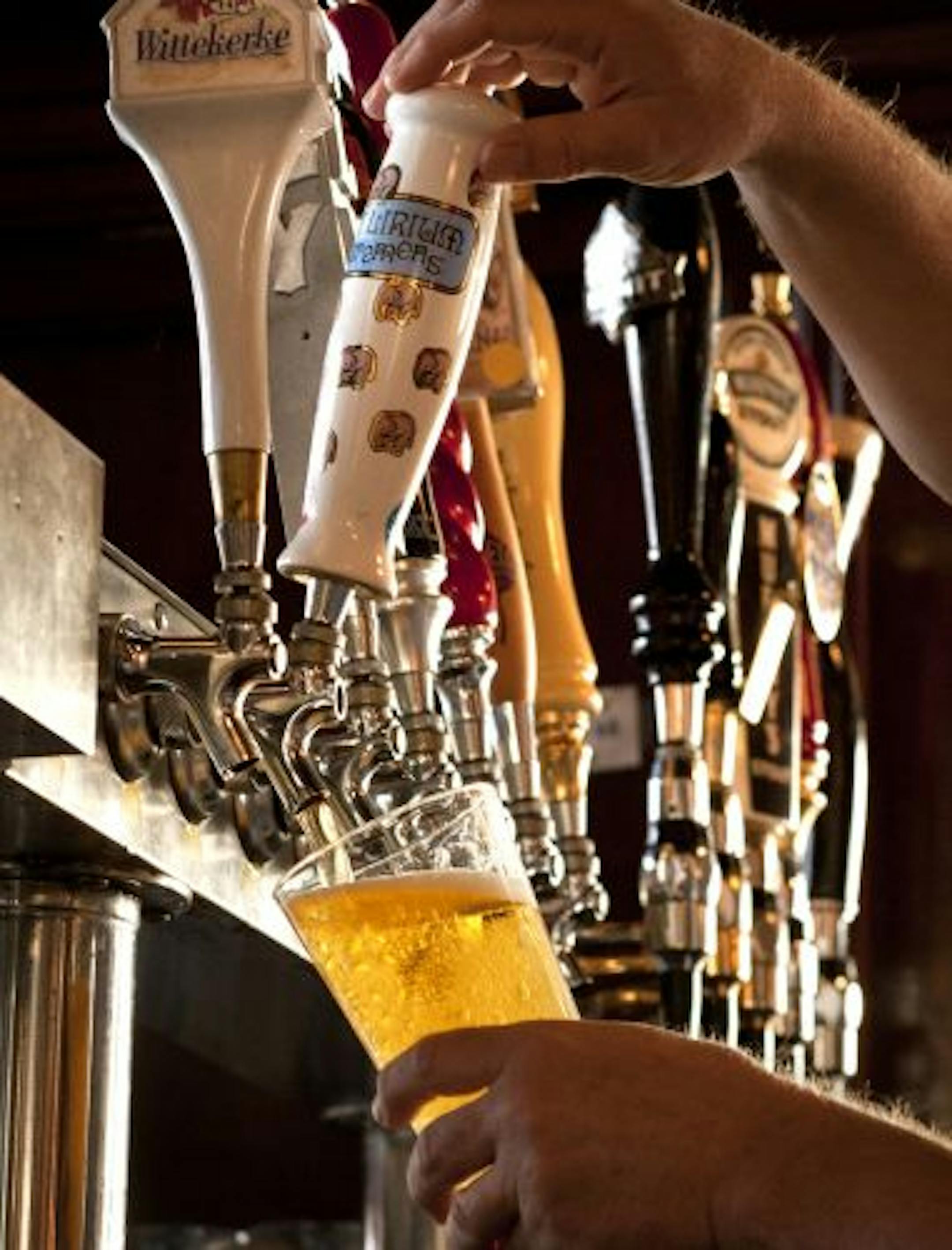 Mark van Wie poured a glass of Delirium Tremens brewed by Brouwerij Huyghe, in Melle, Belgium. This is one of 49 drafts available at the Muddy Pig in St. Paul.