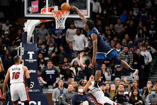 Wolves guard Anthony Edwards was charged with an offensive foul on this dunk against Miami on Nov. 24 at Target Center.