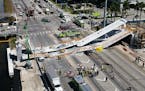This photo provided by DroneBase shows the collapsed pedestrian bridge at Florida International University in the Miami area on Thursday, March 15, 20