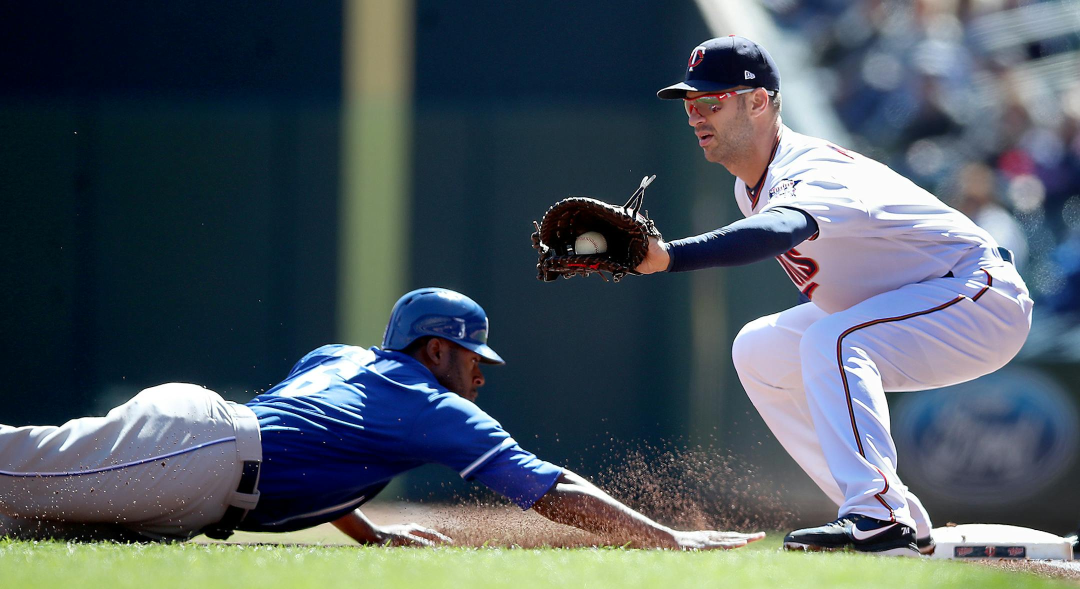 Royals Lorenzo Cain slid safely back to first as pitcher Kyle Gibson threw the ball to Joe Mauer during the first inning as the Twins took on the Royals at Target Field, Thursday, April 6, 2017 in Minneapolis, MN. ] ELIZABETH FLORES ï liz.flores@startribune.com