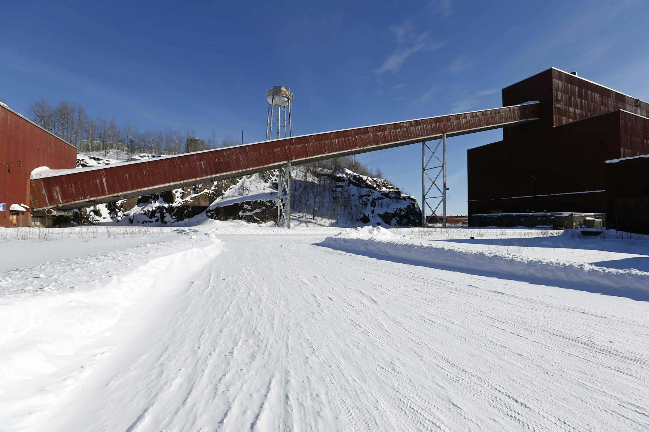 FILE - This Feb. 10, 2016 file photo shows a former iron ore processing plant near Hoyt Lakes, Minn., that would become part of a proposed PolyMet copper-nickel mine. Legal challenges to the proposed PolyMet copper-nickel mine enter a new phase this week when a judge opens a fact-finding hearing into allegations that the Minnesota Pollution Control Agency improperly tried to suppress serious concerns by the federal Environmental Protection Agency about the project's risks to clean water. (AP Pho