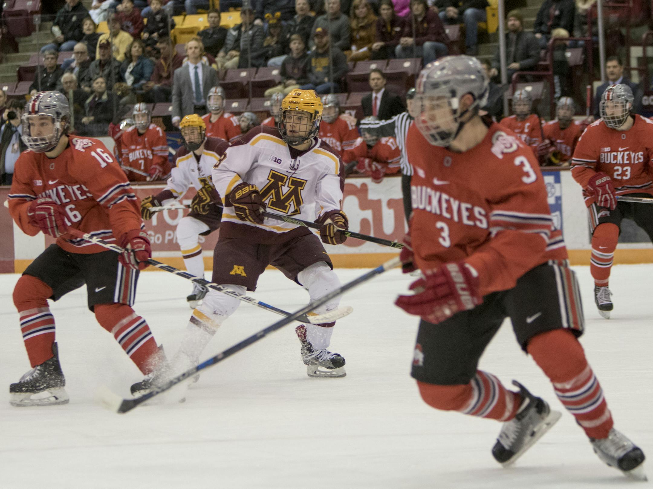 Ohio State Buckeyes forward Matthew Weis (16), Ohio State Buckeyes defenseman Sasha Larocque (3) and Minnesota Golden Gophers forward Leon Bristedt (18) follow the puck as the Minnesota Golden Gophers hosted the Ohio State Buckeyes to open the Big Ten Conference schedule on December 4, 2015. ] Special to Star Tribune MATT BLEWETT &#xef; matt@mattebphoto.com - December 4, 2015, Minneapolis, MN, Big Ten Hockey, Minnesota Golden Gophers vs. Ohio State Buckeyes, 257622 UPUK 120415