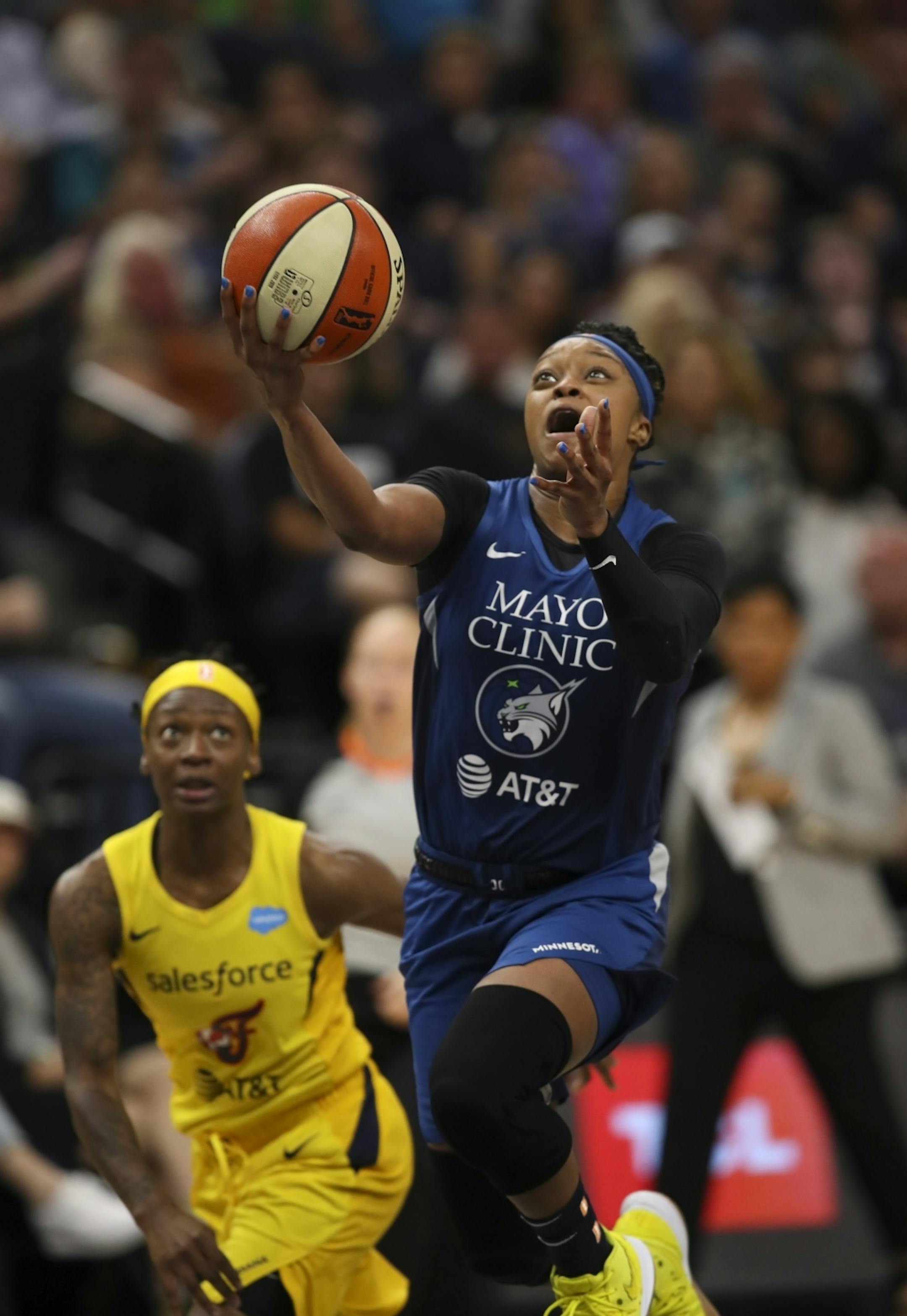 After out running the defense of Indiana Fever guard Erica Wheeler (17), Minnesota Lynx guard Odyssey Sims (1) gave the Lynx a 58-57 lead with under a minute left in the third quarter. She led the Lynx with 17 points.