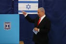 Israeli Prime Minister Benjamin Netanyahu prepared to cast his ballot at a polling station in Jerusalem as Israelis voted in a general election on Tue