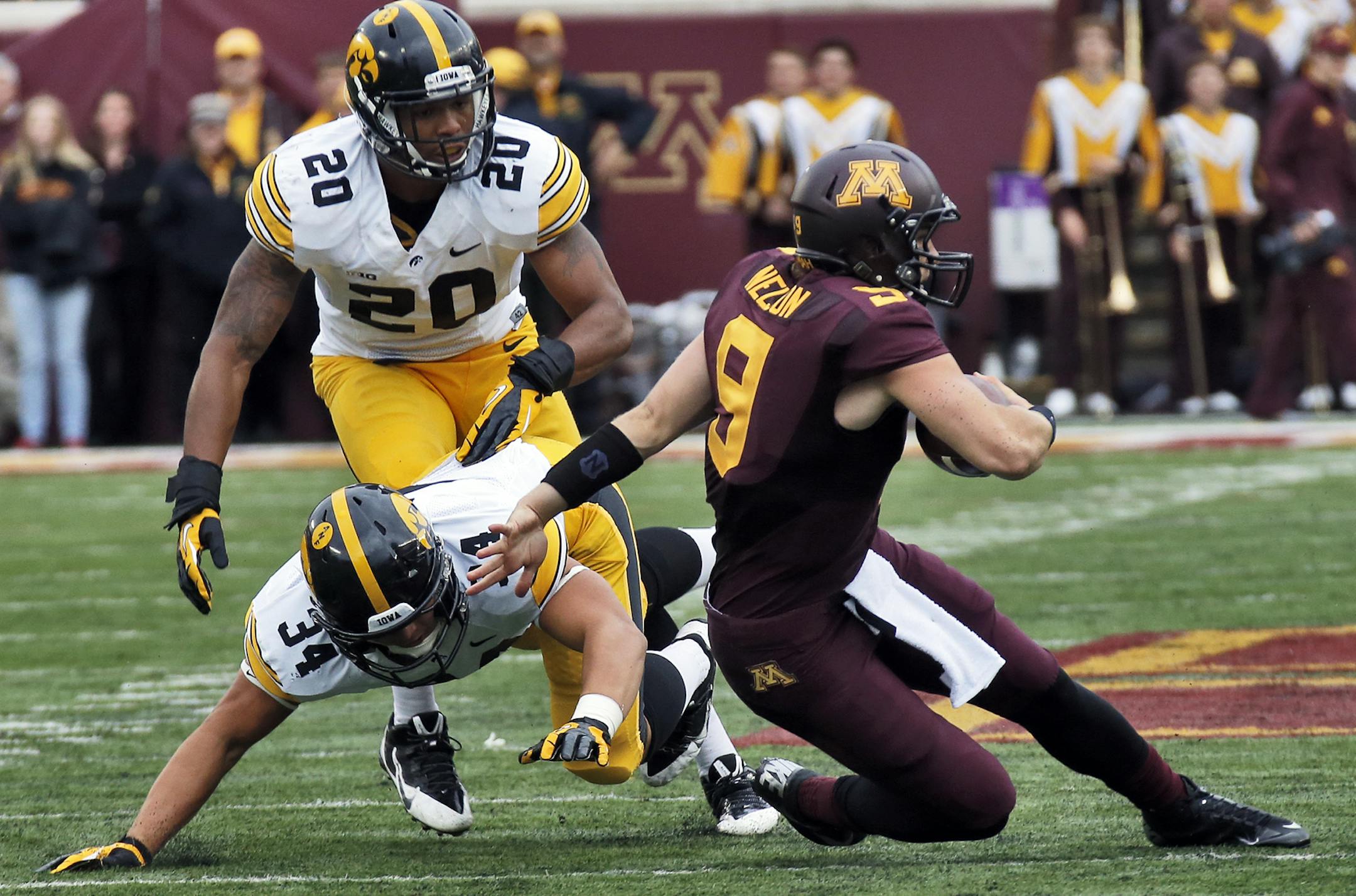 Iowa Hawkeyes va. Minnesota Gophers football. A previously injured Philip Nelson (9) started the game as Minnesota's quarterback, but was thrown for a loss on this first half play. (MARLIN LEVISON/STARTRIBUNE(mlevison@startribune.com)