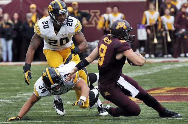 Iowa Hawkeyes va. Minnesota Gophers football. A previously injured Philip Nelson (9) started the game as Minnesota's quarterback, but was thrown for a