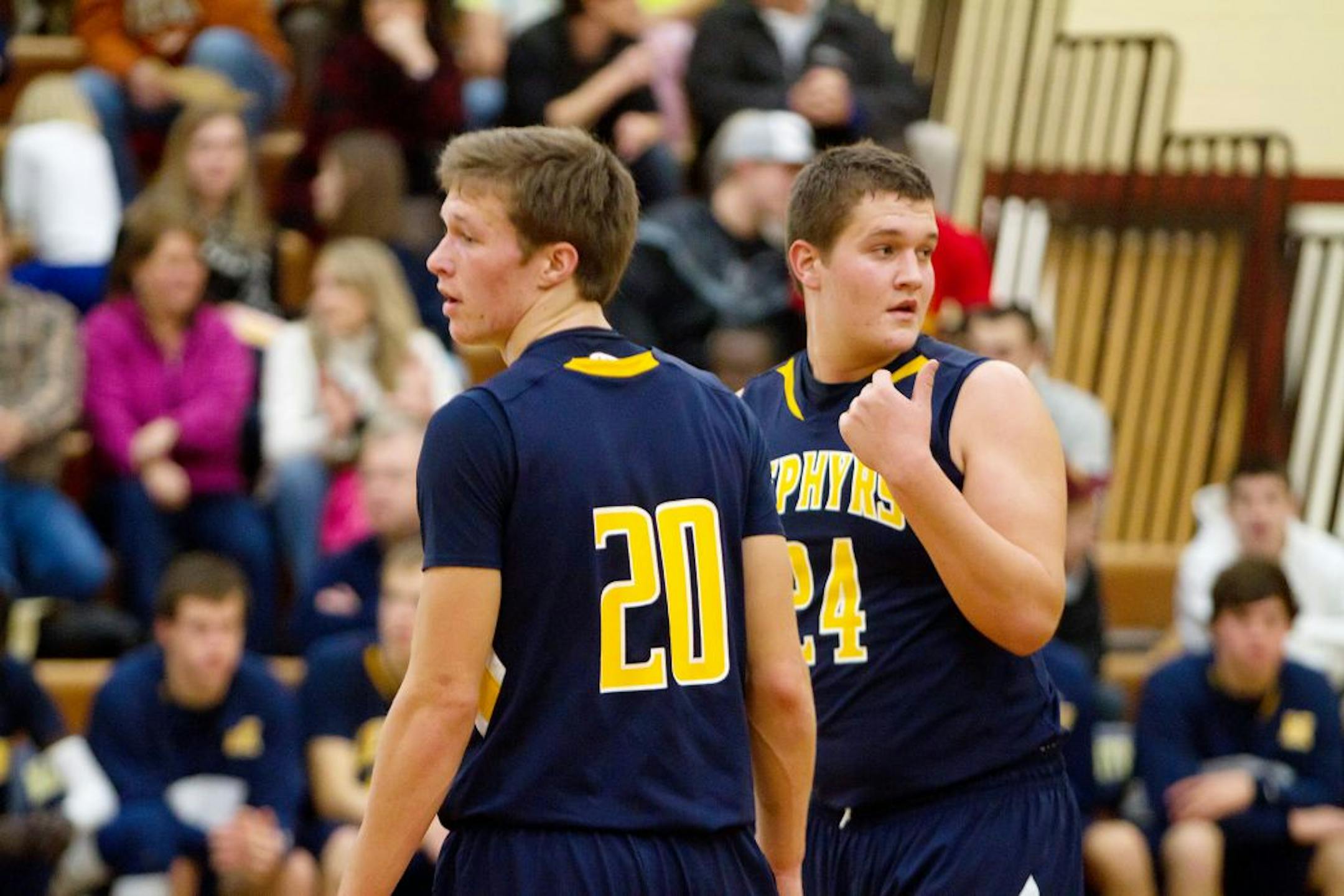 Mahtomedi's Andrew Lindquist (20) and Zach Lindquist (24)