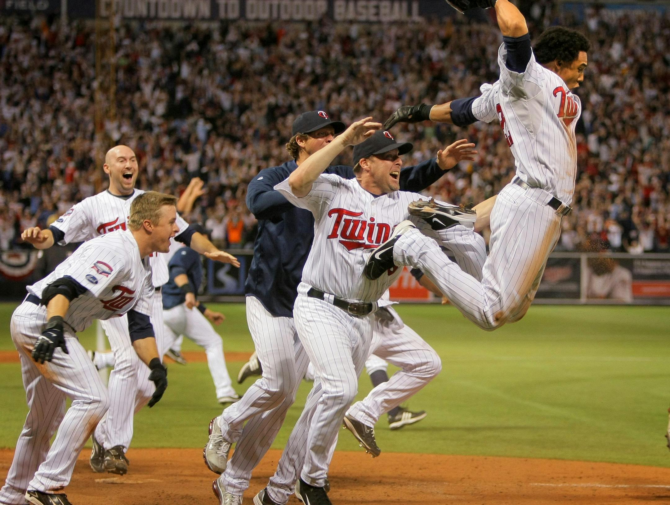 Carlos Gomez -- one of the Twins' "Loose Cannons" -- jumped for joy after scoring the winning run in the 12th inning on an Alexi Casilla single against the Tigers in Game 163 in 2009, a tiebreaker that sent the Twins into the postseason.
