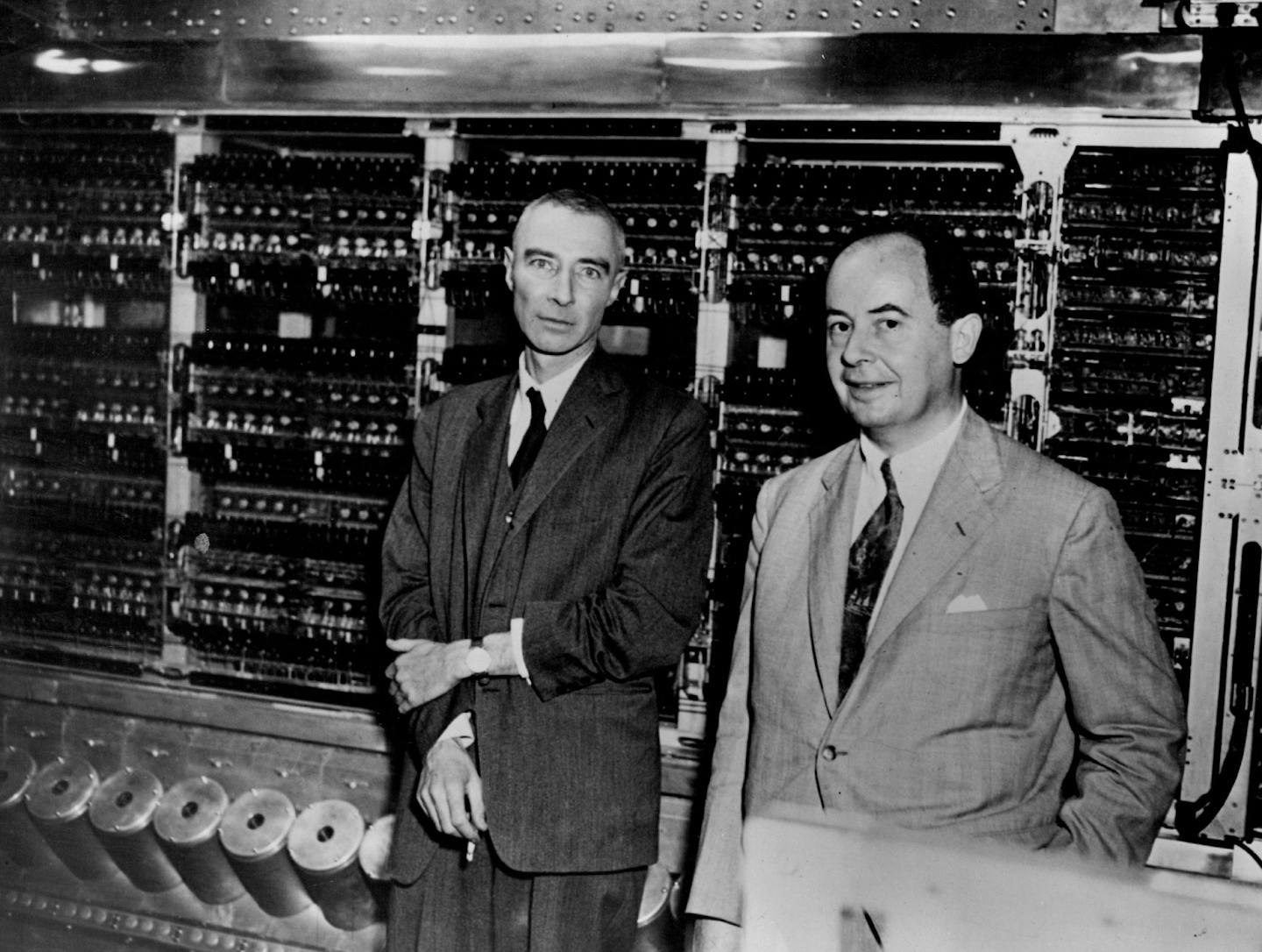 June 10, 1952 New electronic "brain' displayed Dr.J.Robert oppenheimer ( left) and Dr.John von Neumann,stand in front of a new electronic "brain' , The fastest computing machine fob sts degree of precis son yet made* the machine which can do 2,00 multiple scat ions un one . Second and add or subtract 100000 times in the same period fas displayed today for the first time at the institute for advanced study. Its fabulous memory can store 1024, numbers of 12 decimal places each. Dr,Oppeneumann was one of the sponsors of the brain. International News Photo