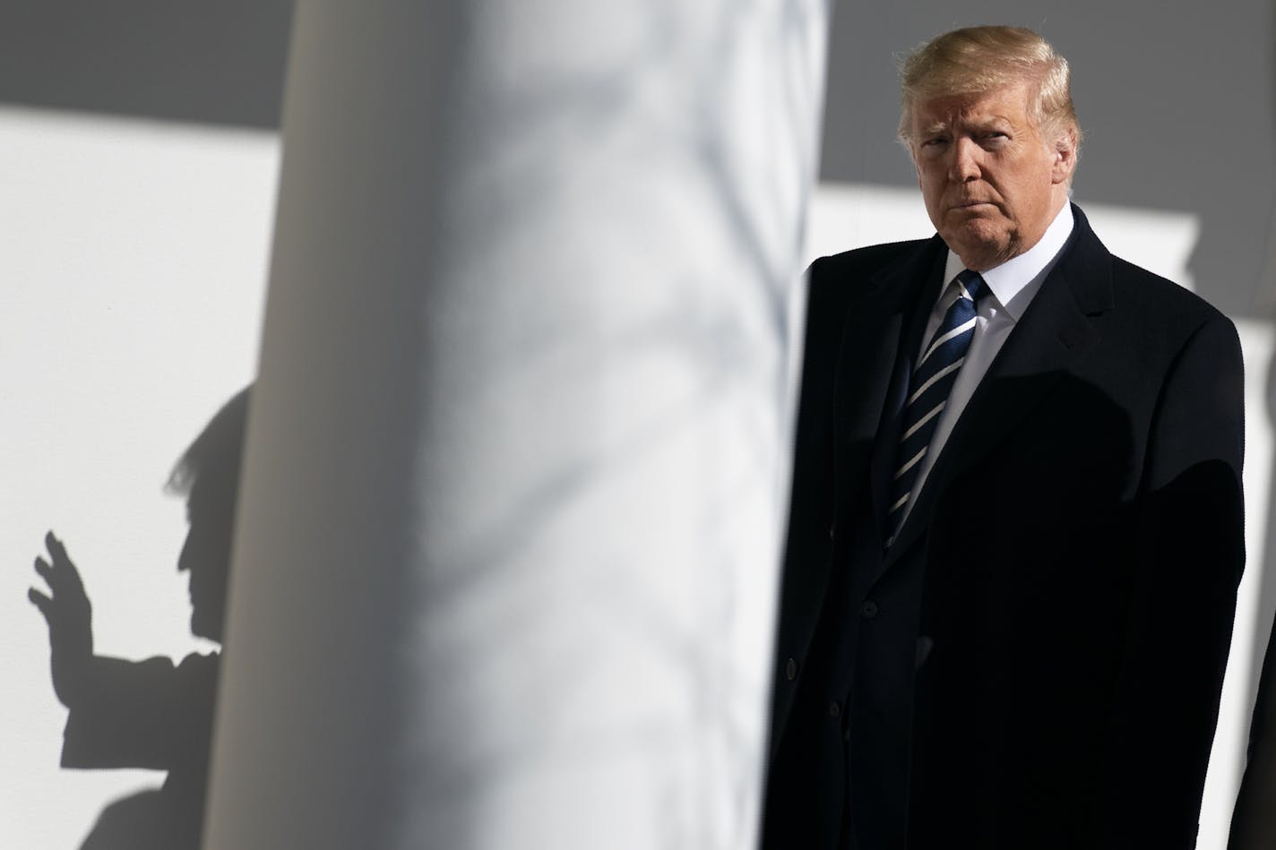 President Donald Trump walks to a meeting in the Oval Office of the White House with Israeli Prime Minister Benjamin Netanyahu, Monday, Jan. 27, 2020, in Washington. (AP Photo/ Evan Vucci)