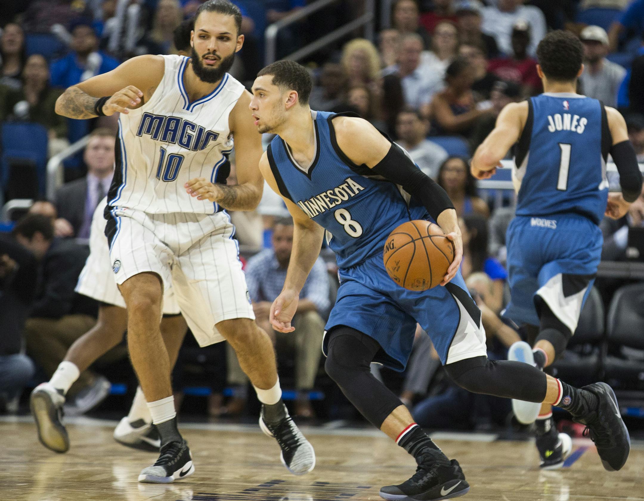 Minnesota Timberwolves guard Zach LaVine (8) dribbles by Orlando Magic guard Evan Fournier (10) during the second half of an NBA basketball game in Orlando, Fla., Wednesday, Nov. 9, 2016. The Timberwolves won 123-107. (AP Photo/Willie J. Allen Jr.)