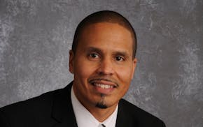 Michael Thomas, a Minneapolis school administrator, was recruited in 2011.