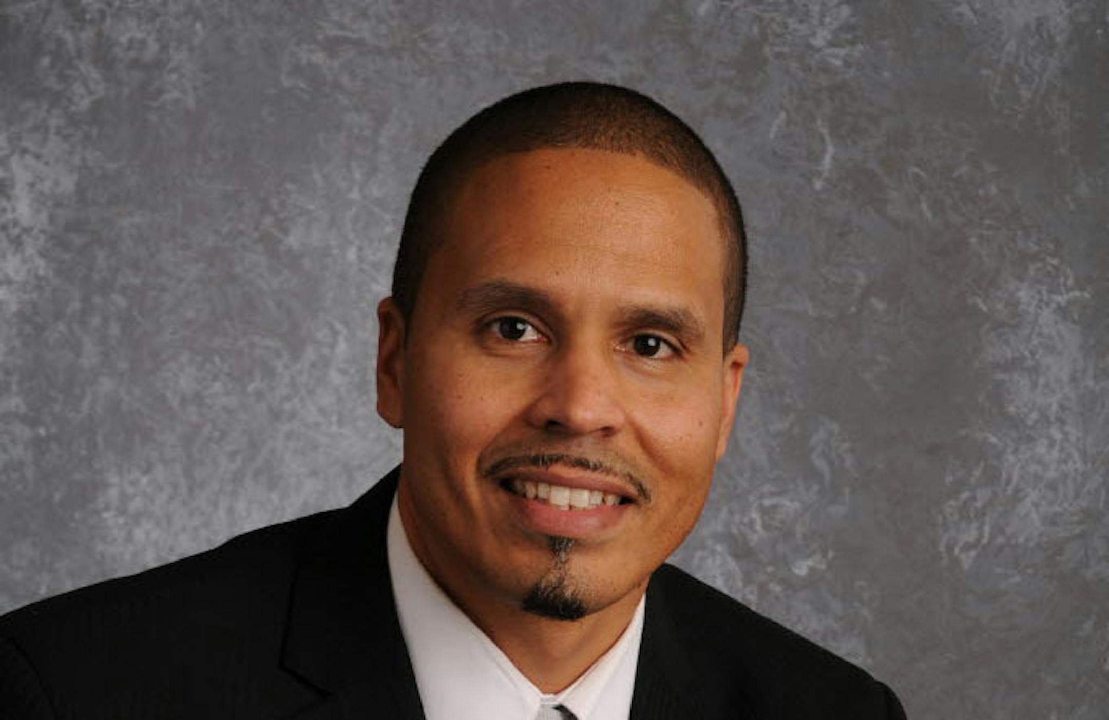 Michael Thomas, a Minneapolis school administrator, was recruited in 2011.