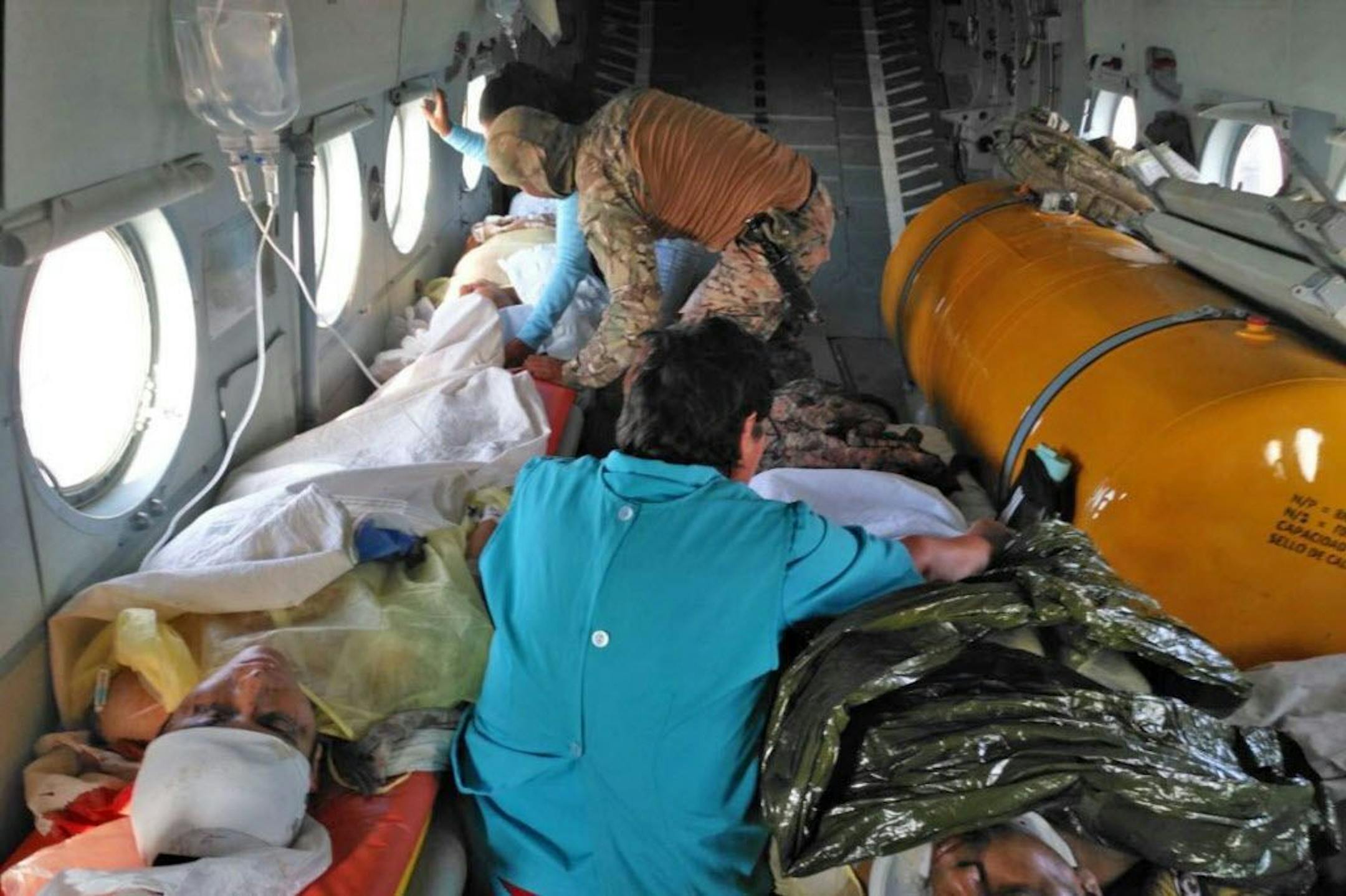 Injured persons are evacuated aboard a helicopter after a bus crash in Arequipa, Peru, Wednesday, Feb. 21, 2018. At least 25 people were killed when their bus veered off a highway and tumbled 200 meters down a cliff.
