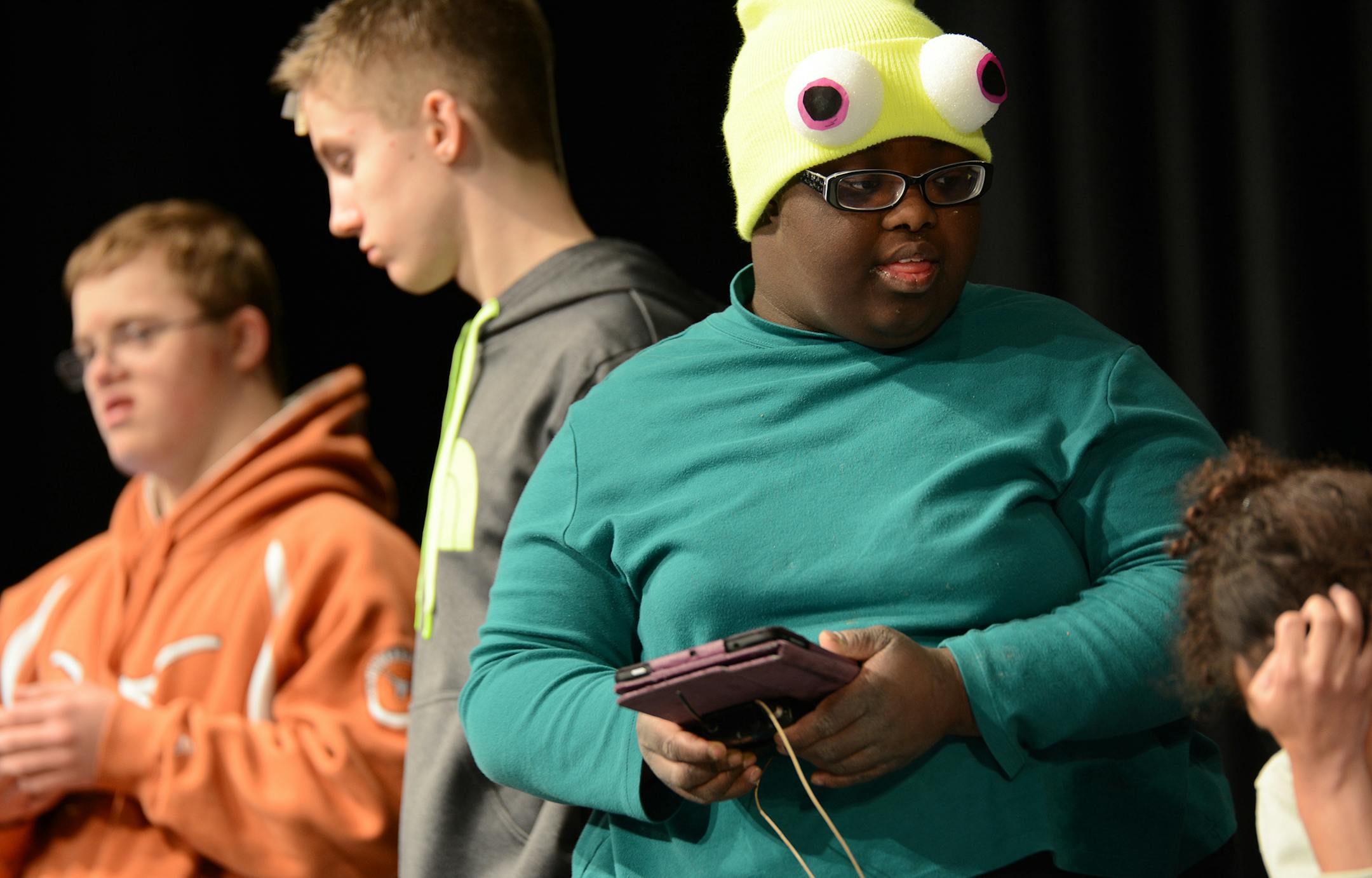 Blaine high school senior Faith Ansah, center, delivered her lines using an iPad during a rehearsal for the production of ìFinding Nemo.î Photo by Liz Rolfsmeier, Special to the Star Tribune