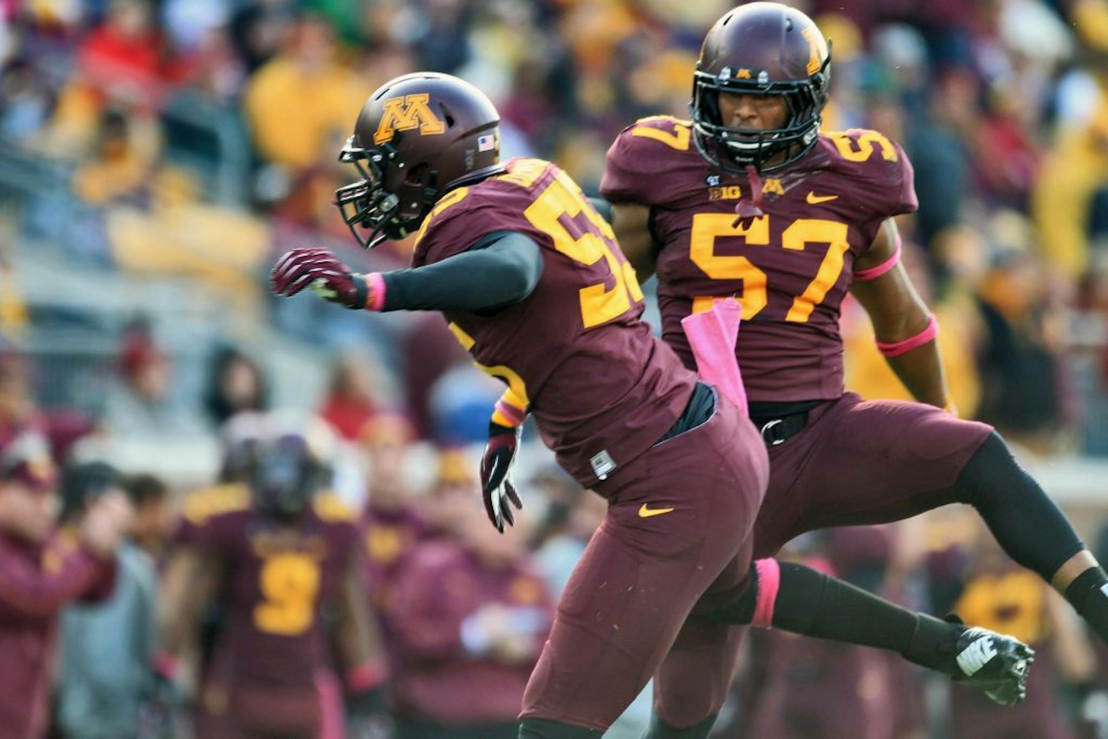 Minnesota Gophers vs. Purdue Boilermakers football. Defensive players Theiren Cockran, left, and Aaron Hill celebrated a Gophers sack of the Purdue quarterback in 1st half action.