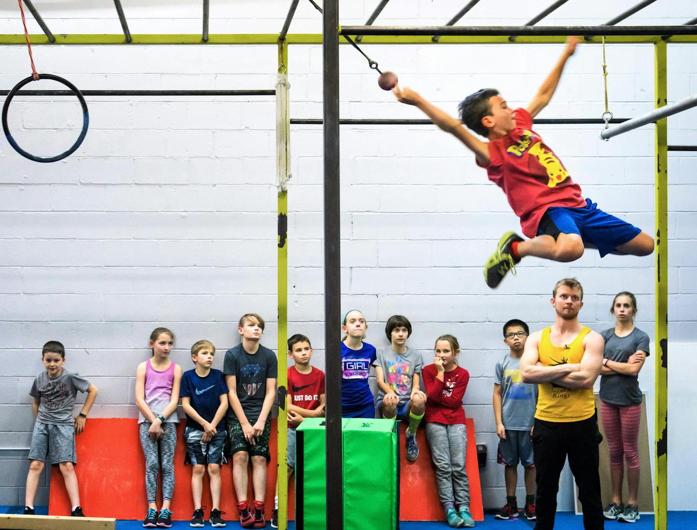 Ellis Rothke flew across the grip line at Obstacle Academy, which was started by a mom who competed on "American Ninja Warrior."