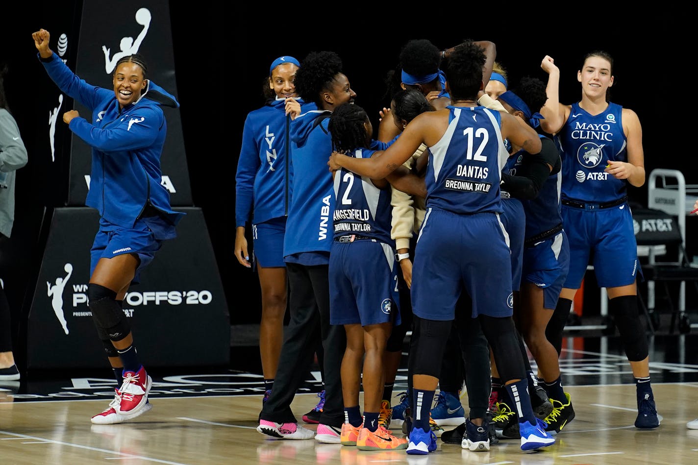 The Minnesota Lynx celebrate their win over the Phoenix Mercury during a WNBA playoff basketball game Thursday, Sept. 17, 2020, in Bradenton, Fla. (AP Photo/Chris O'Meara)