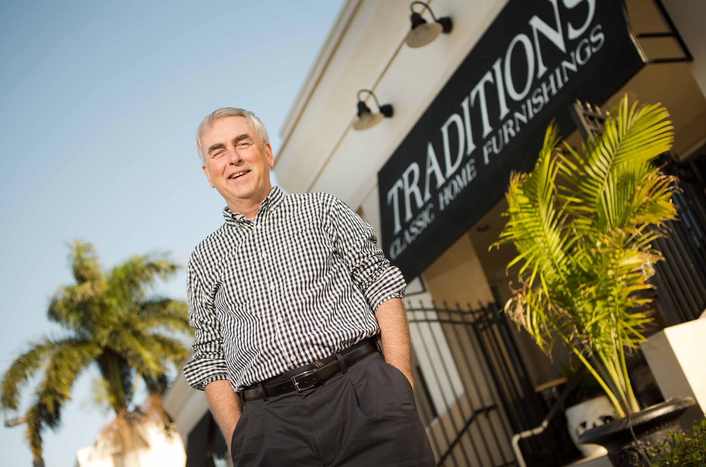 Mike Schumann, co-owner, with his wife, Suzanne, of Traditions Classic Home Furnishings, outside the Naples, Fla., store. A big share of their Florida business comes from Minnesotans with second homes in the Naples area.