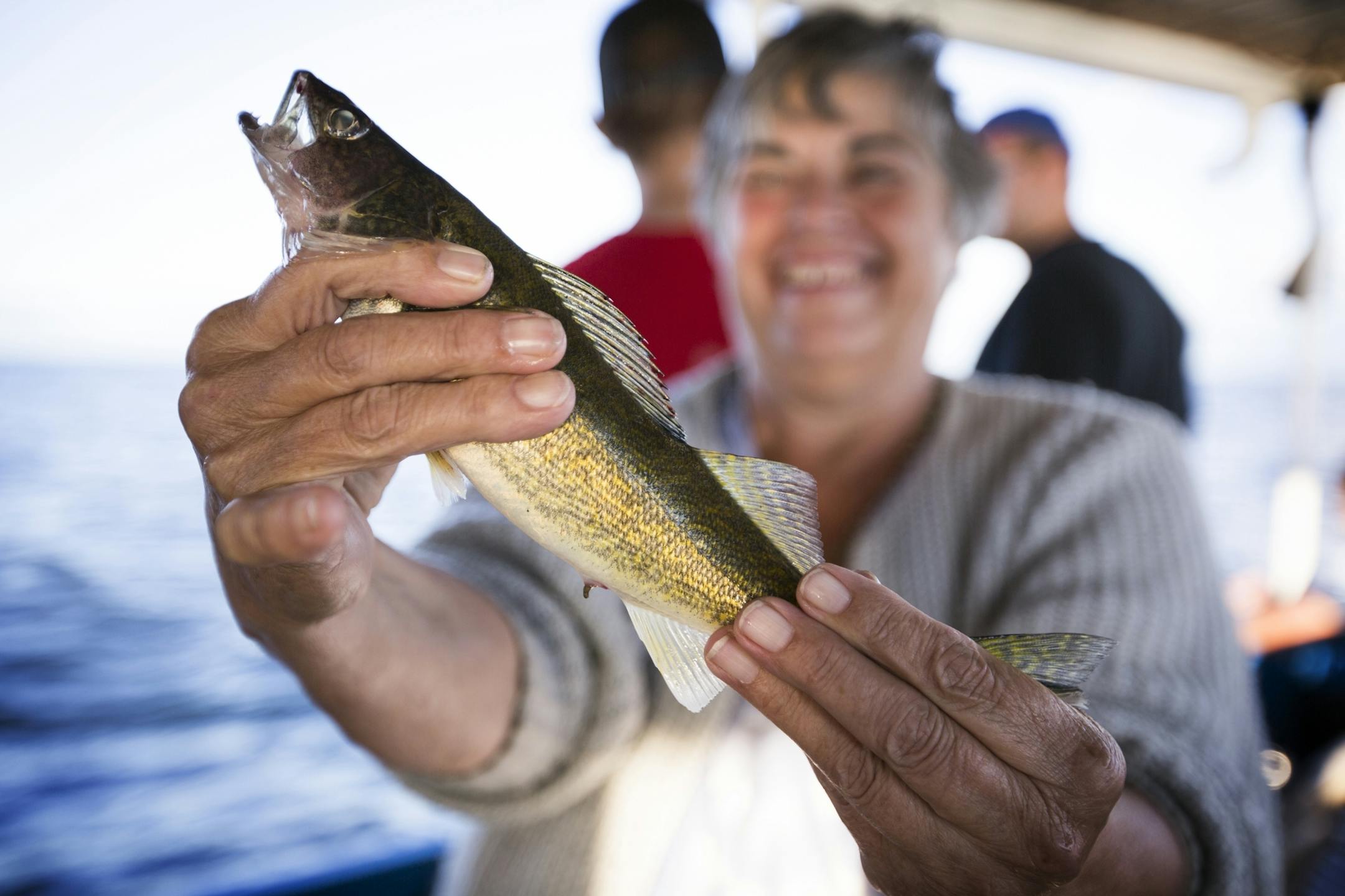 Joyce Shackelford of Des Moines poses for a photo with a walleye she caught (and then released) during a fishing expedition with Twin Pines Resort on Mille Lacs Lake Monday, August 3, 2015.