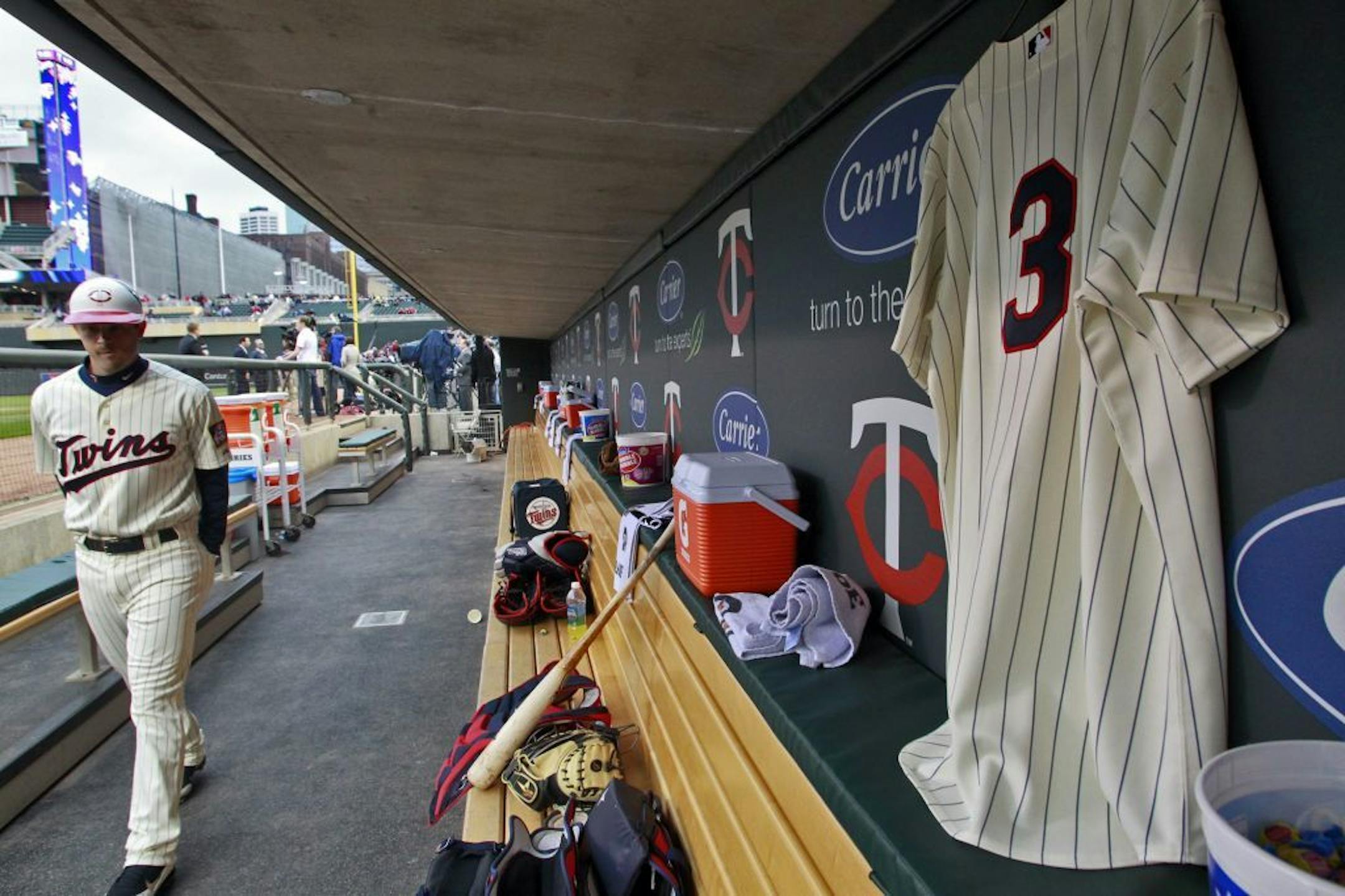 Twins catcher Drew Butera walked through the Twins dugout that displays a Harmon Killebrew #3 jersey on a wall in honor of the ailing Twins great.