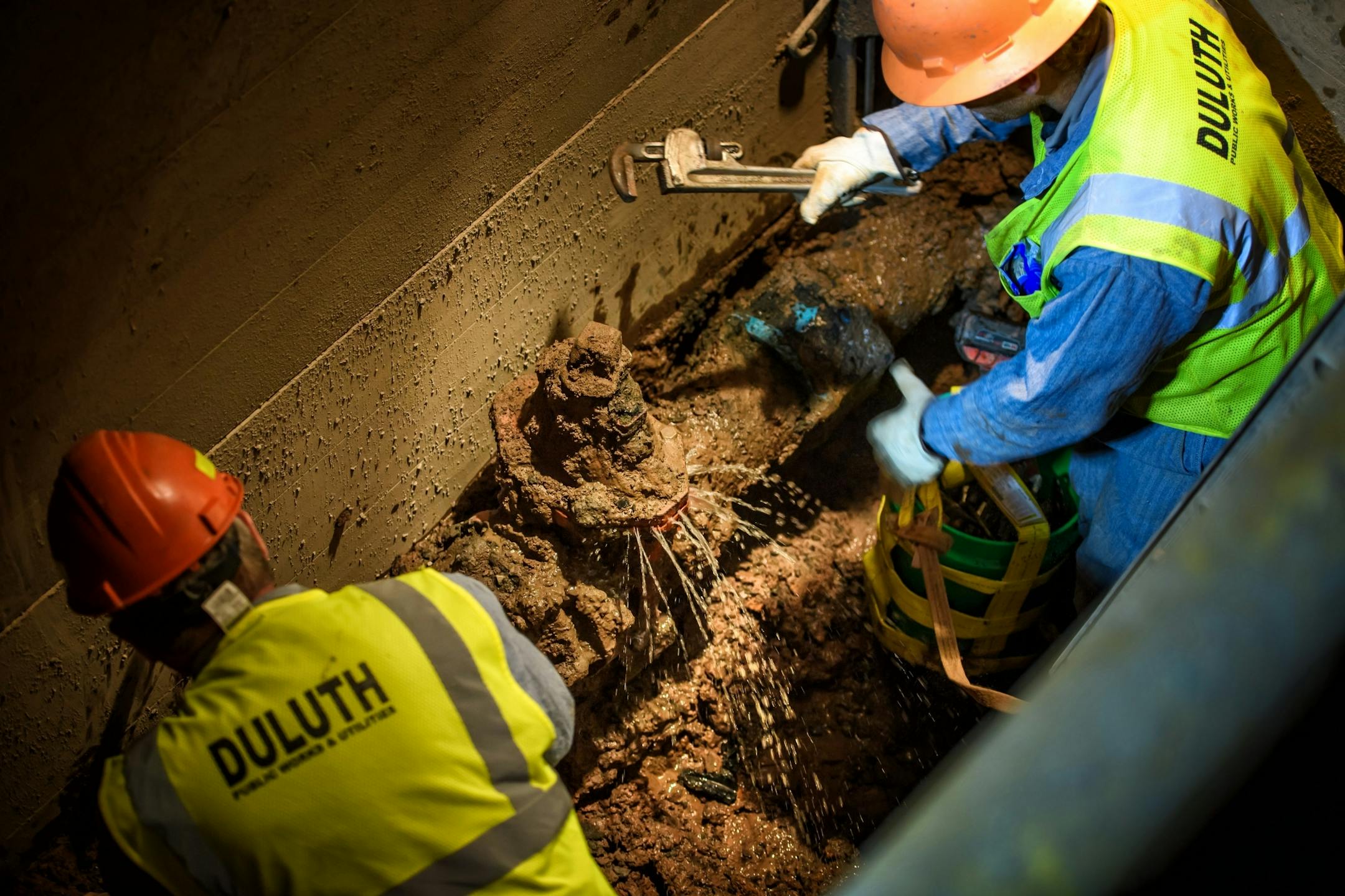 Workers from Duluth Public Works and Utilities Department replace a broken water main valve at Grand Avenue and 40th Ave West. Work was done overnight to avoid disrupting traffic during the day.