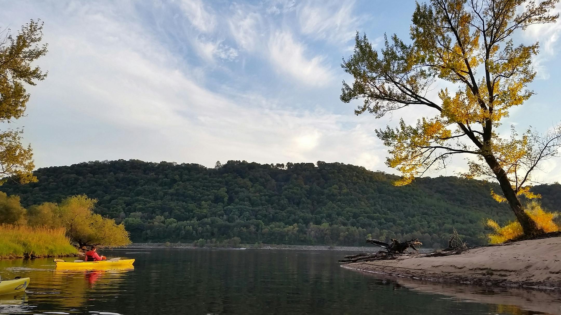 Kayakers paddle down the Mississippi River. Courtesy of Broken Paddle Guiding