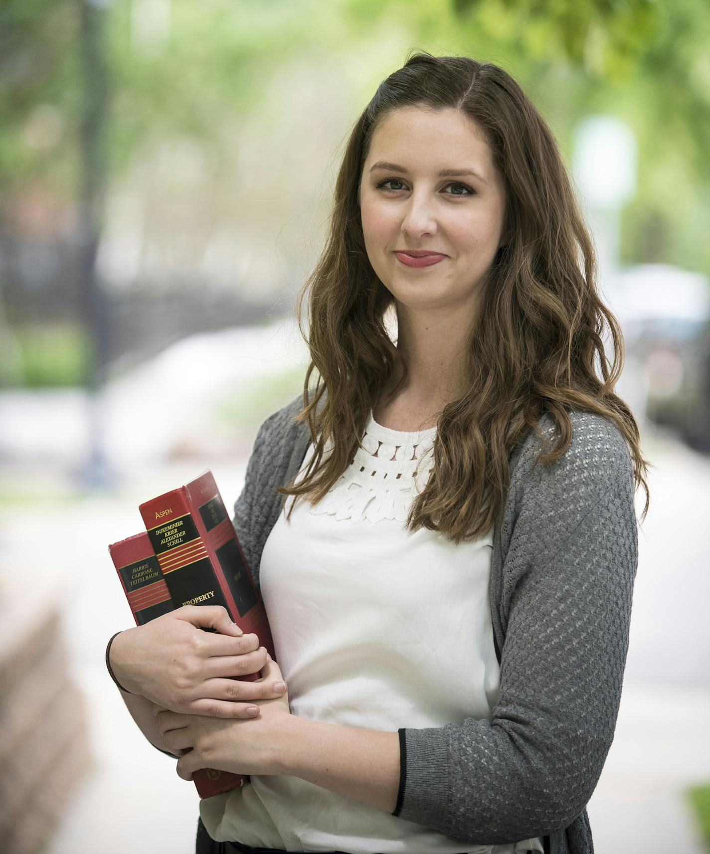 University of Minnesota law student Christina Squiers was photographed outside her apartment near Loring Park Friday afternoon. ] (AARON LAVINSKY/STAR TRIBUNE) aaron.lavinsky@startribune.com The U Law School is introducing a new program that will guarantee a lucky few third-year students a job when they graduate in 2017. The Public Interest Residency Program, which will be formally announced Monday, allows select students to skip most of their third year of classes while working full-time at the