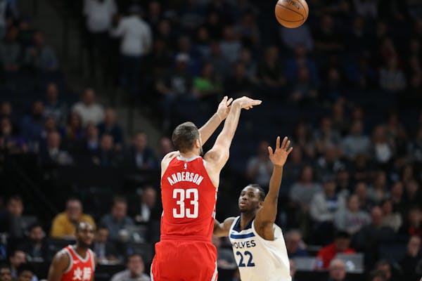 Rockets forward Ryan Anderson hit a three-pointer over Timberwolves forward Andrew Wiggins