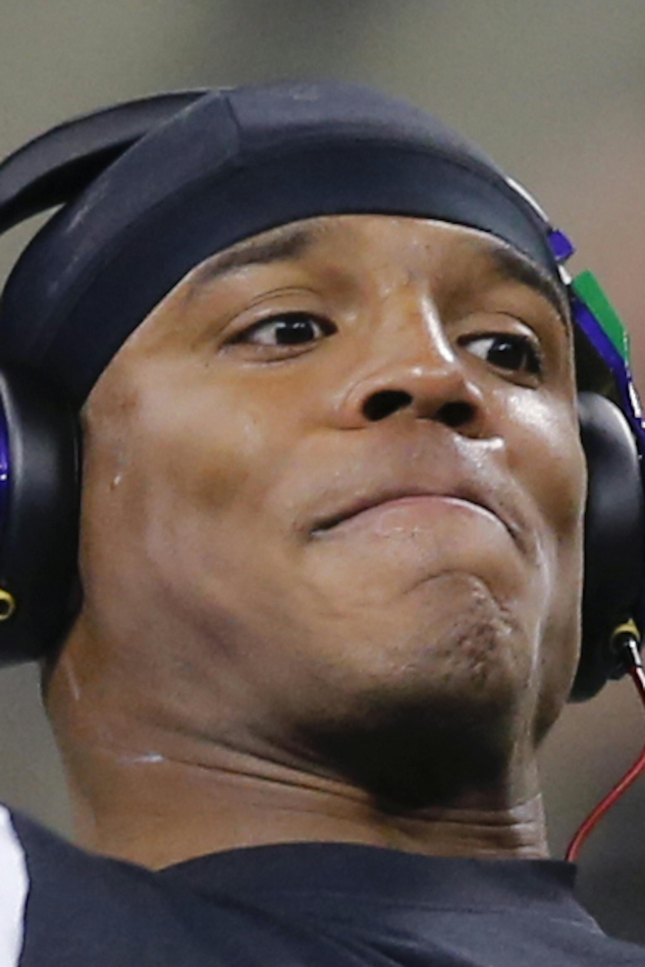 Carolina Panthers quarterback Cam Newton warms up before an NFL football game against the New Orleans Saints in New Orleans, Sunday, Dec. 7, 2014. (AP Photo/Bill Haber)