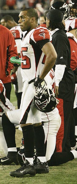 Atlanta Falcons' Brent Grimes (43) and Chris Crocker, right, watch as Arizona Cardinals' Neil Rackers makes a game-winning field goal in overtime of a