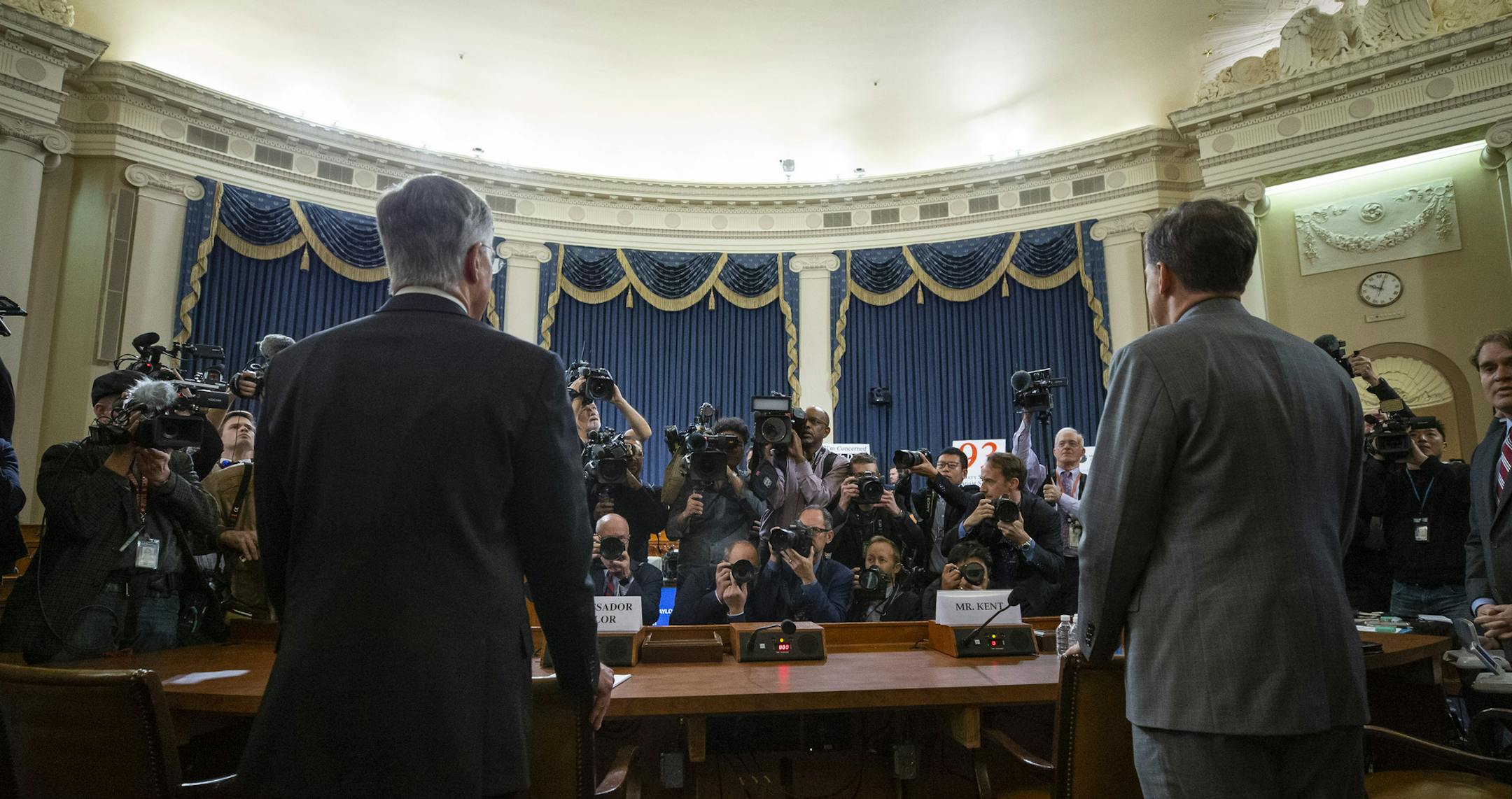 Top U.S. diplomat in Ukraine William Taylor, left, and career Foreign Service officer George Kent arrive to testify during an impeachment hearing of the House Intelligence Committee on Capitol Hill, Wednesday Nov. 13, 2019 in Washington. (AP Photo/Alex Brandon)
