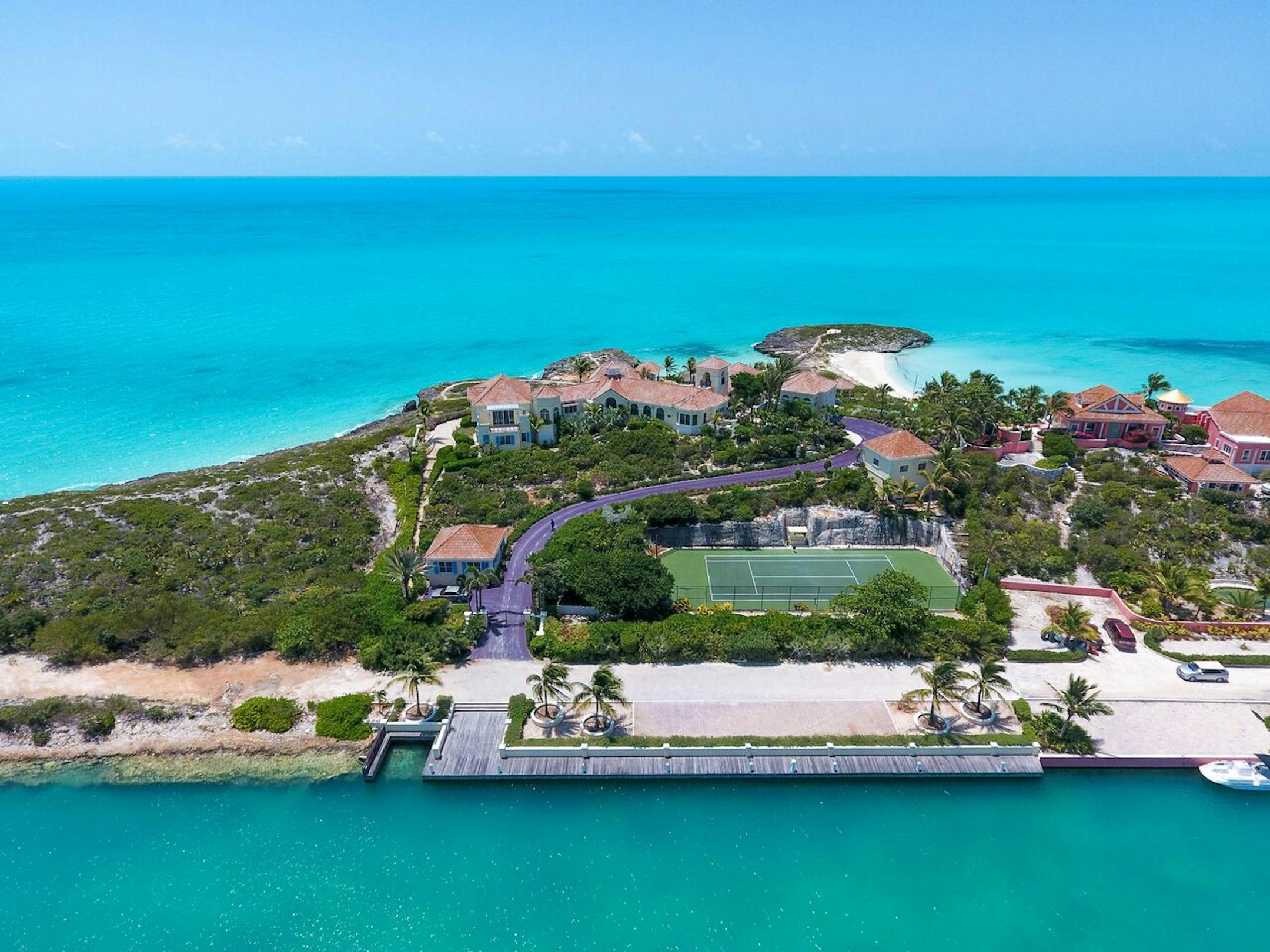 The property comes with a long, winding driveway painted in Prince's signature purple.