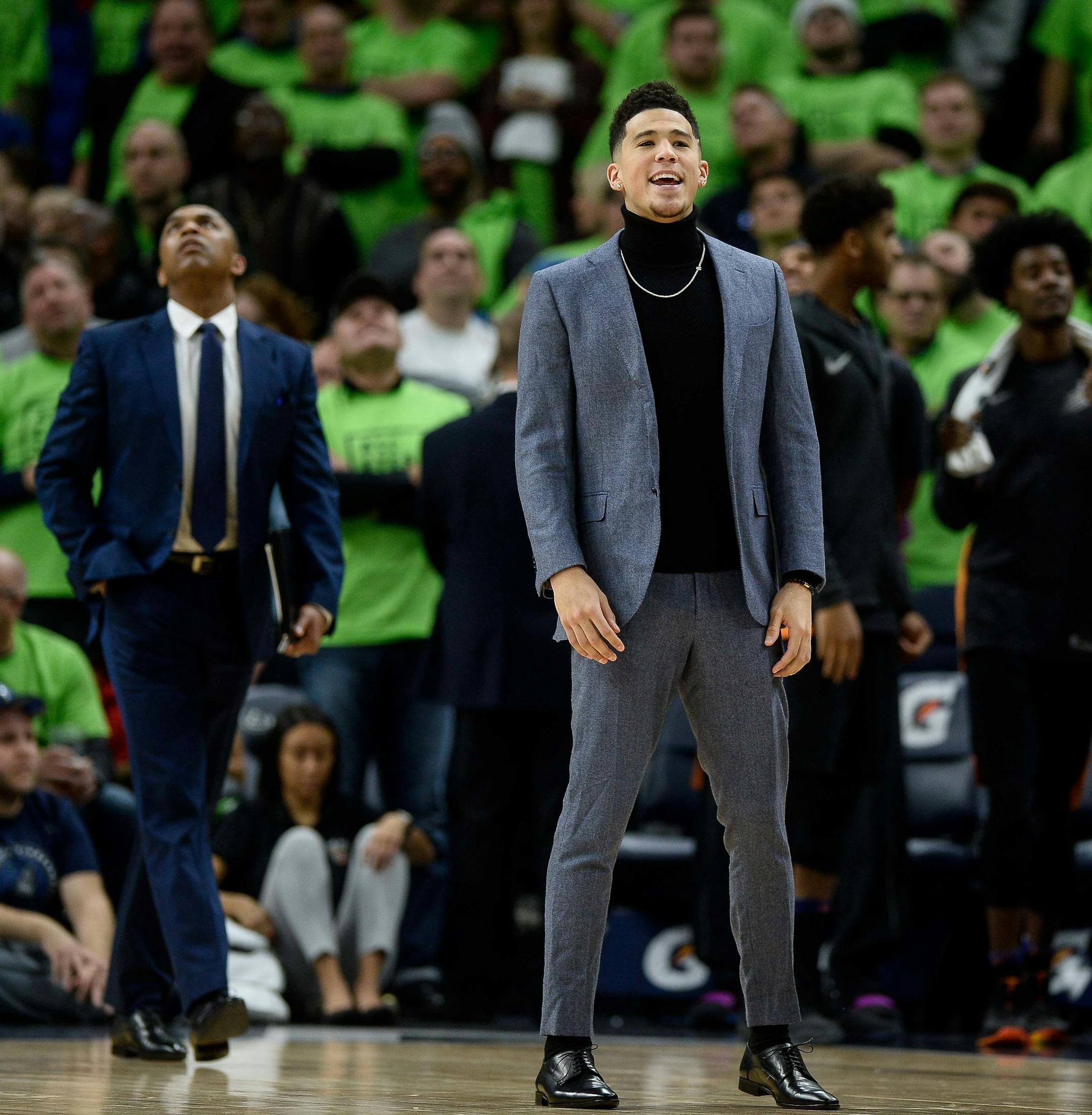Injured Phoenix Suns guard Devin Booker (1) stepped out onto the court following a shooting foul call against the Timberwolves late in the fourth quarter. ] AARON LAVINSKY ï aaron.lavinsky@startribune.com The Minnesota Timberwolves played the Phoenix Suns on Saturday, Dec. 16, 2017 at Target Center in Minneapolis, Minn.