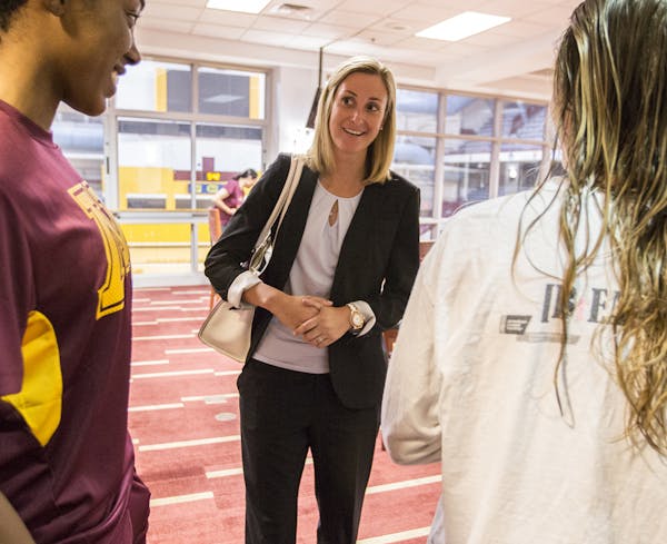 University of Minnesota interim athletic director Beth Goetz chatted with members of the women's volleyball team at Williams Arena.