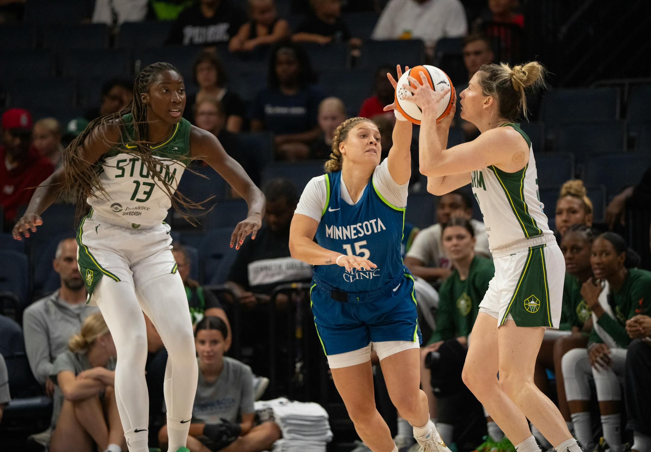 The Seattle Storm's Sami Whitcomb was fouled by Minnesota Lynx guard Rachel Banham in the first quarter.