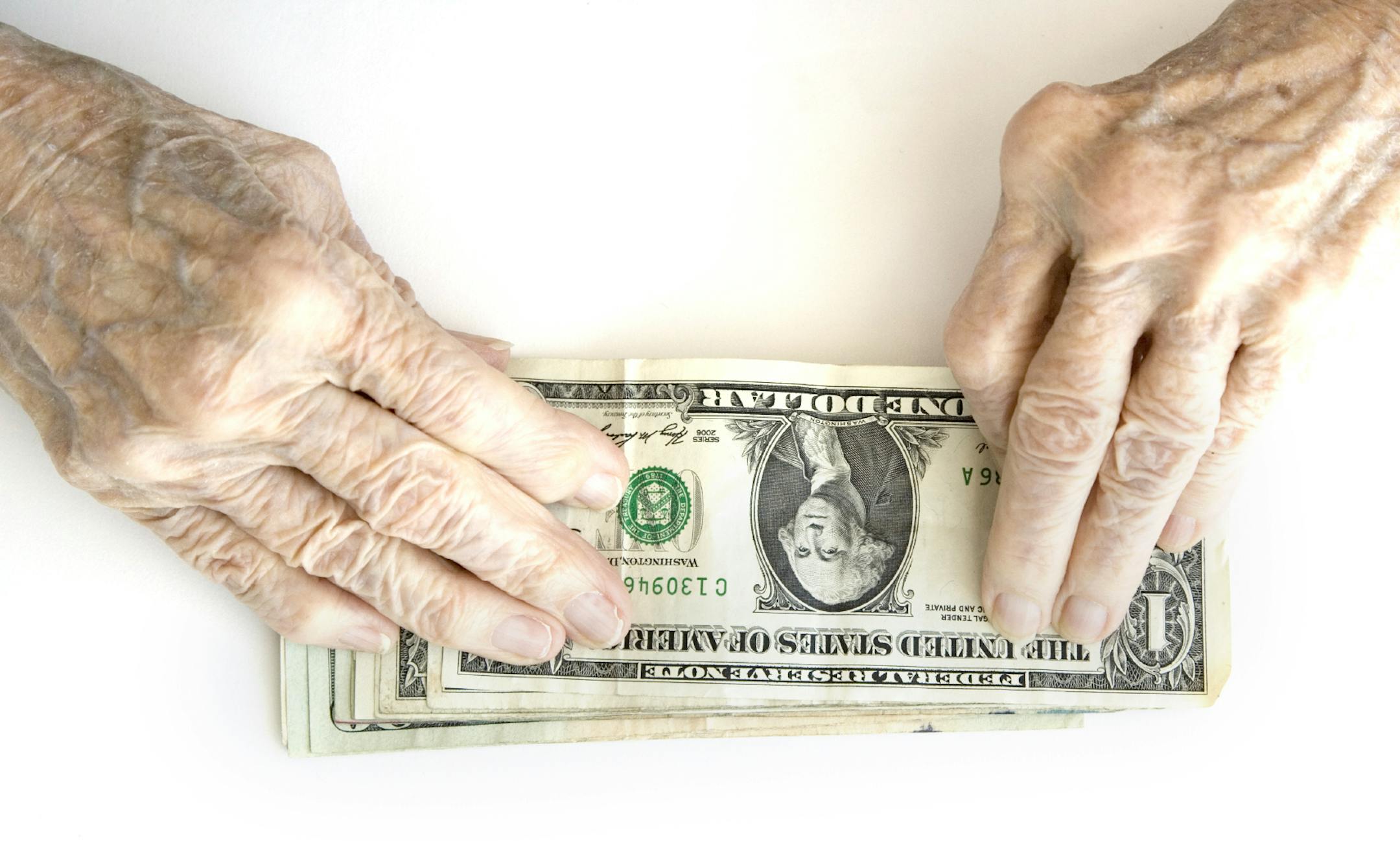 Old hand and money