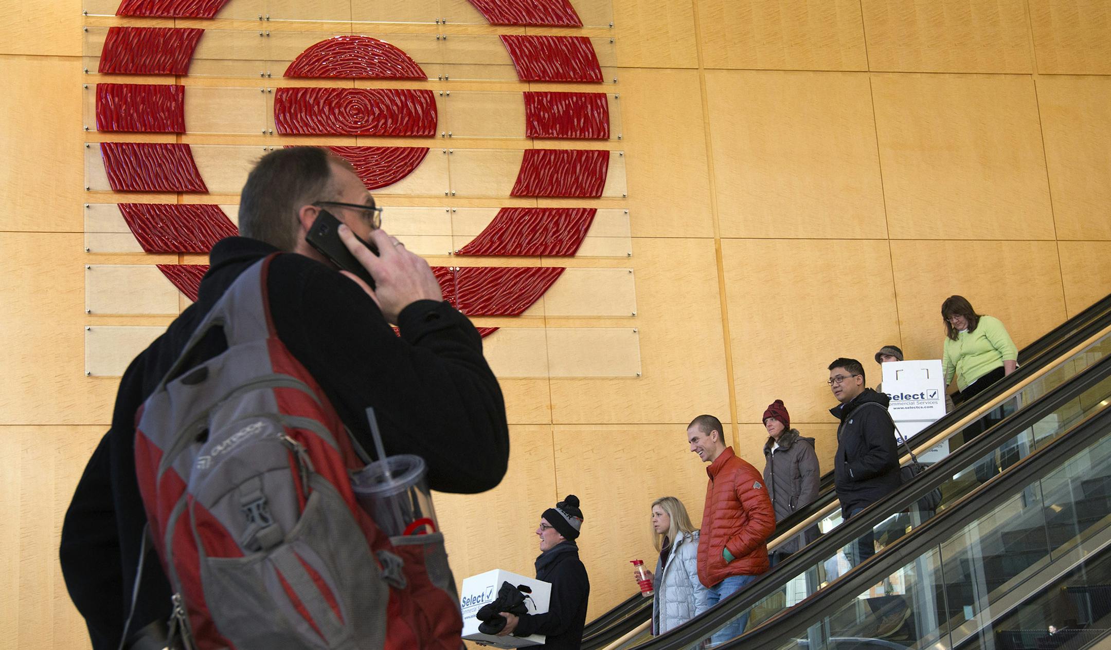 Target employees were once again filing out of Target Corporate headquarters in Downtown Minneapolis Wednesday afternoon with boxes of personal belongings after Target Corp. announced they would be laying off about 550 employees who work in the Twin Cities as it continues to wind down its Canadian business. ] BRIAN PETERSON • brianp@startribune.com Minneapolis, MN - 2/11/2015 ORG XMIT: MIN1502111320322508