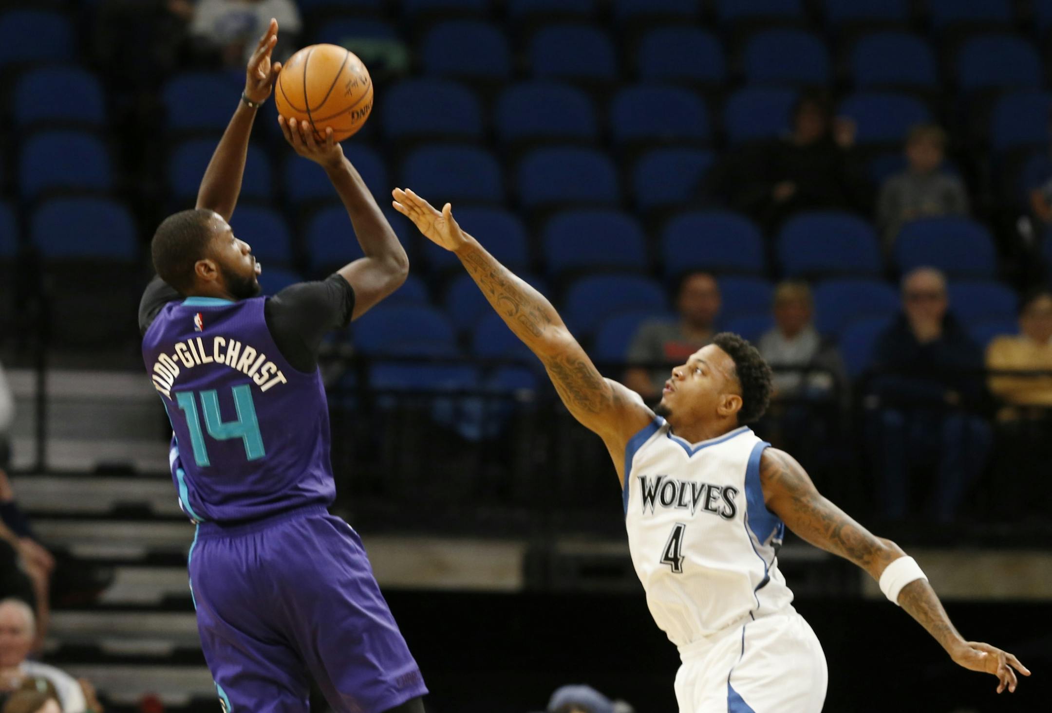Charlotte Hornets' Michael Kidd-Gilchrist shoots over Minnesota Timberwolves' Brandon Rush during the first quarter of an NBA preseason basketball game Friday, Oct. 21, 2016, in Minneapolis.