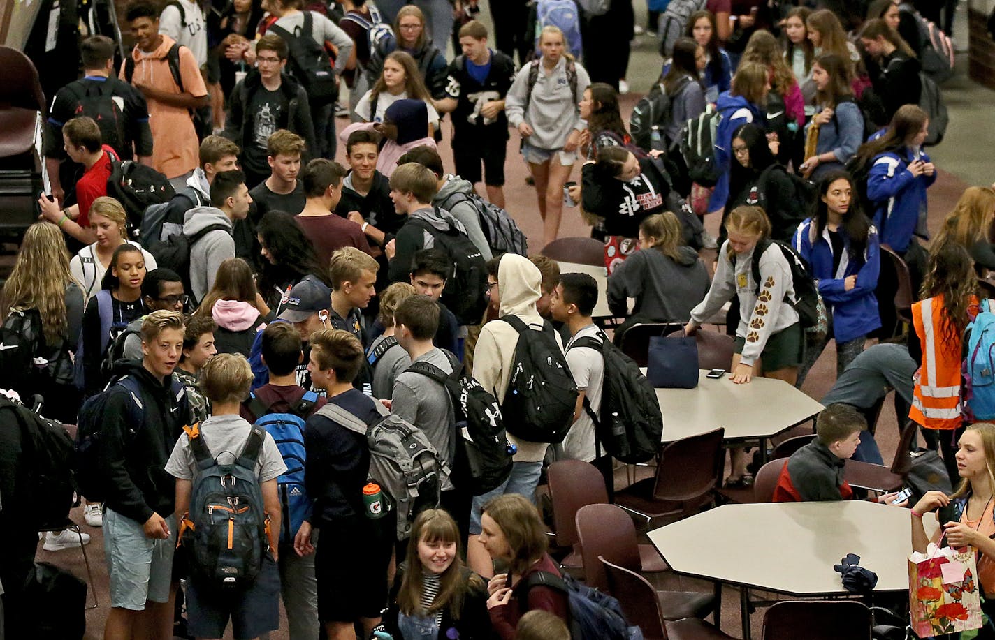 Eastview High students gather in the school's commons before the start of classes Thursday, Sept. 19, 2018, in Apple Valley, MN.] DAVID JOLES &#xef; david.joles@startribune.com Dakota County officials are taking a new and gentler approach to truancy, once seen as the "gateway drug" to a life of bad behavior. The county recently added three full-time social workers to deal with chronically absent students, engaging their family via home visits rather than the courts, which are no longer involved.