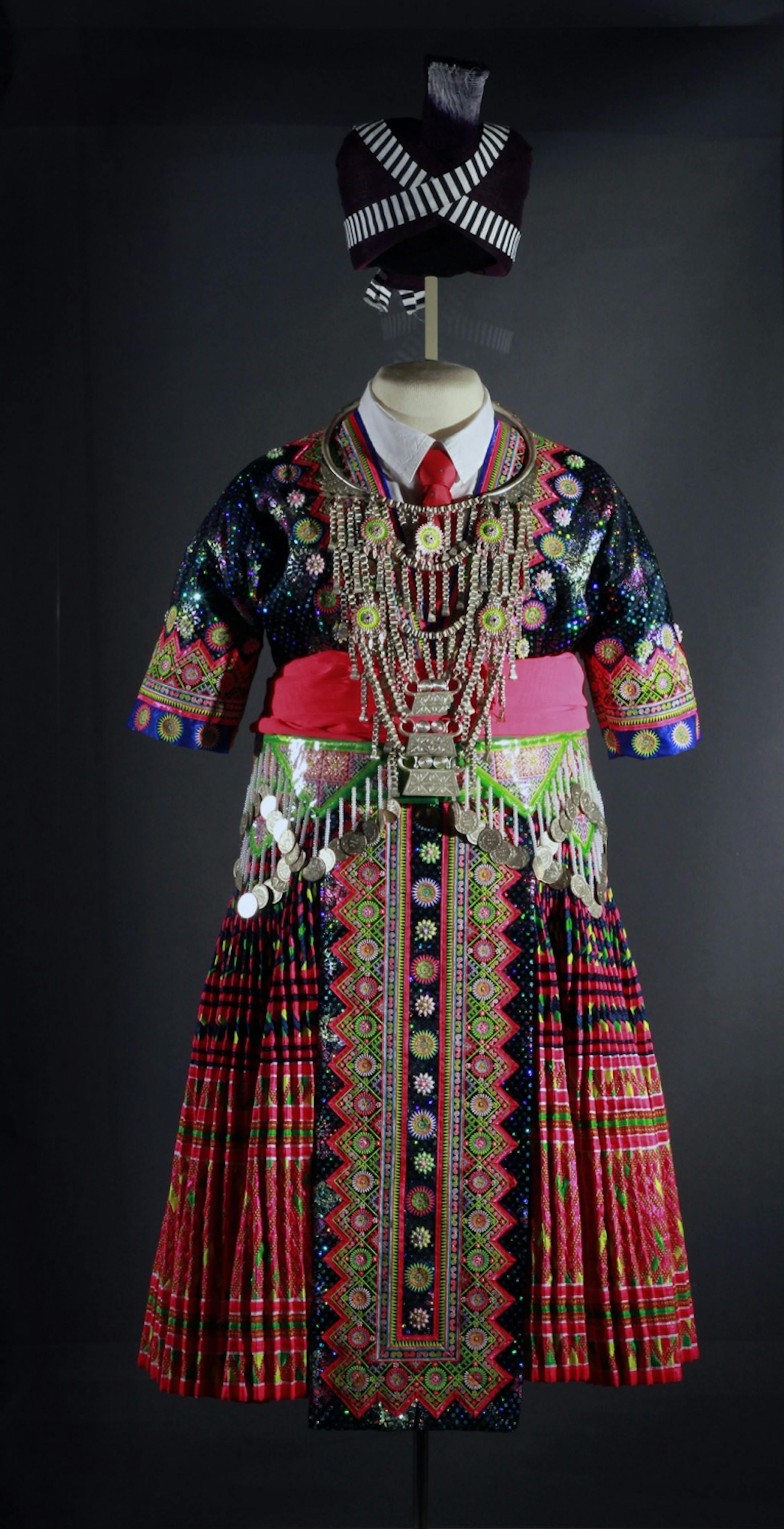 Hmong in Minnesota exhibit at the Minnesota History Center - artifact - a traditional ceremonial dress -Traditional Green Hmong woman's outfit, courtesy Center for Hmong Studies, Concordia University, St. Paul