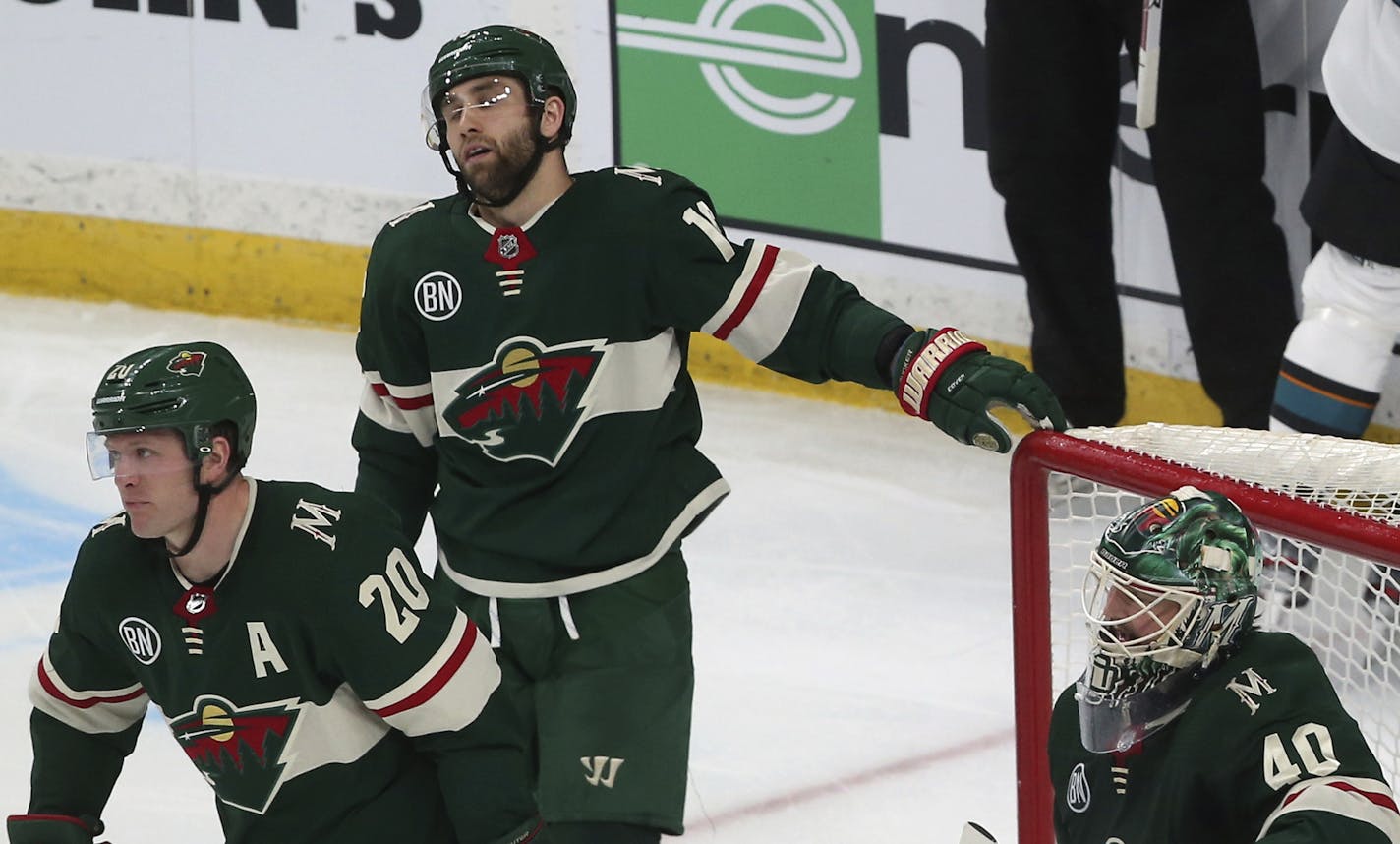 Minnesota Wild's Ryan Suter, left, Jason Zucker, center, and goalie Devan Dubnyk react after San Jose Sharks' Tomas Hertl, of the Czech Republic, scored in the third period of an NHL hockey game Monday, March 11, 2019, in St. Paul, Minn. (AP Photo/Jim Mone)