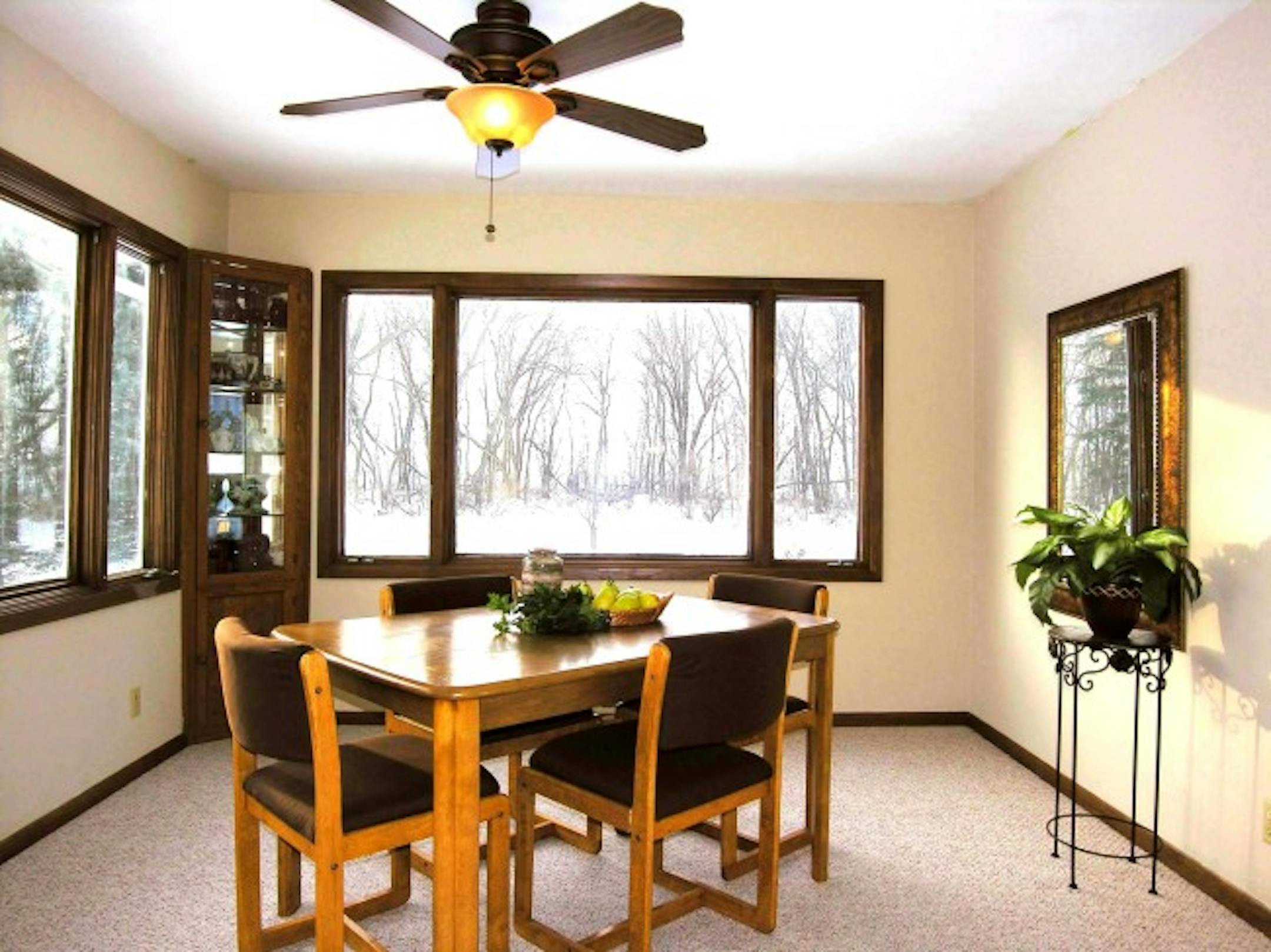 After: The colors were toned down and new carpet was installed. Dated window blinds were removed.