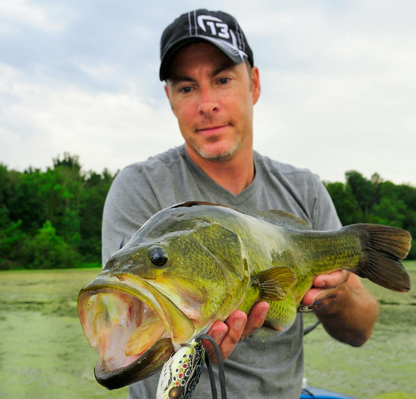 Big largemouth bass like this five-pound-plus beauty have recovered from spawning and are on the prowl, often in shallow water. July is a great time to hook that bass of a lifetime.