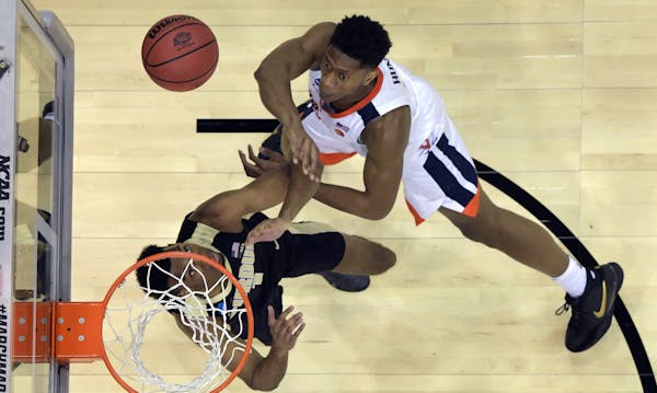 Virginia guard De'Andre Hunter, at 6-7, had no reservations about taking the action to 6-9 Purdue forward Aaron Wheeler in the South Region championsh