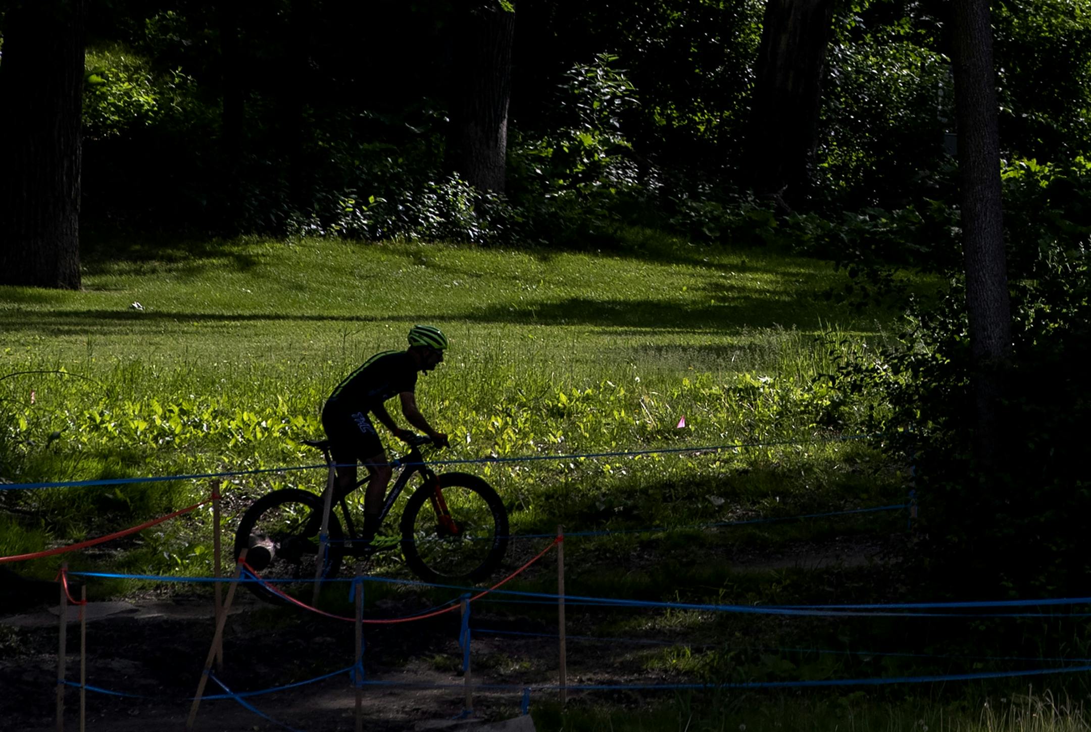 A cyclist made his way around the course before a race at Wirth on Wednesdays Mountain Bike Series held at Theodore Wirth Park. ] CARLOS GONZALEZ ¥ cgonzalez@startribune.com Ð Minneapolis, MN Ð June 19, 2019, Wirth on Wednesdays kicked off this month, with a bike race series., Theodore Wirth Park