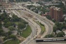 An aerial view from June looking at construction of a replacement for the demolished E. 26th bridge over I-35W, which is part of the major rebuilding 