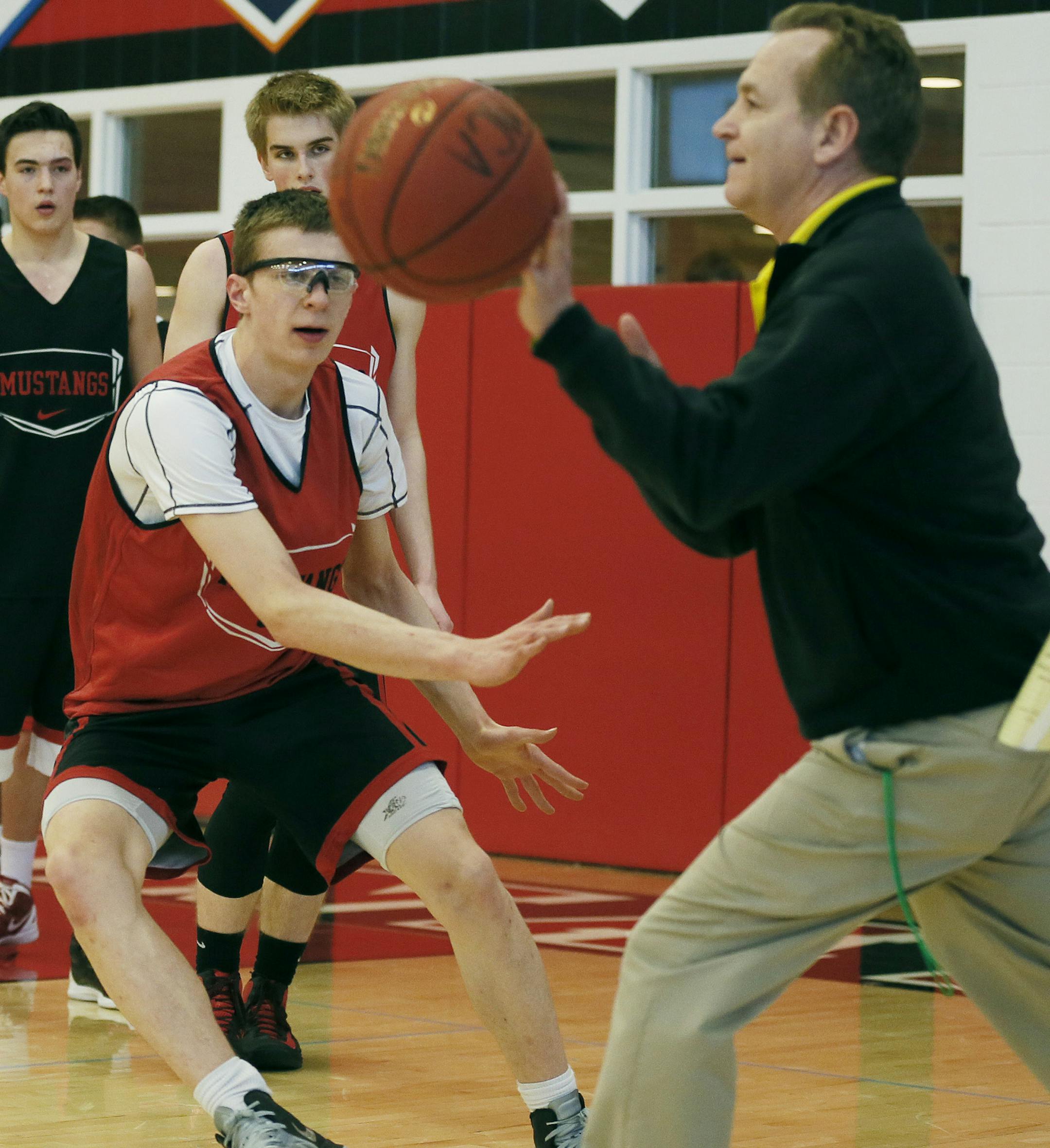 Jeremiah Hanson worked on drills with head coach Jeff Wall as they prepared for the state tournament during practice at Maranatha Academy Tuesday March, 19, 2013 in Brooklyn Park, MN. ] JERRY HOLT ‚Ä¢ jerry.holt@startribune.com