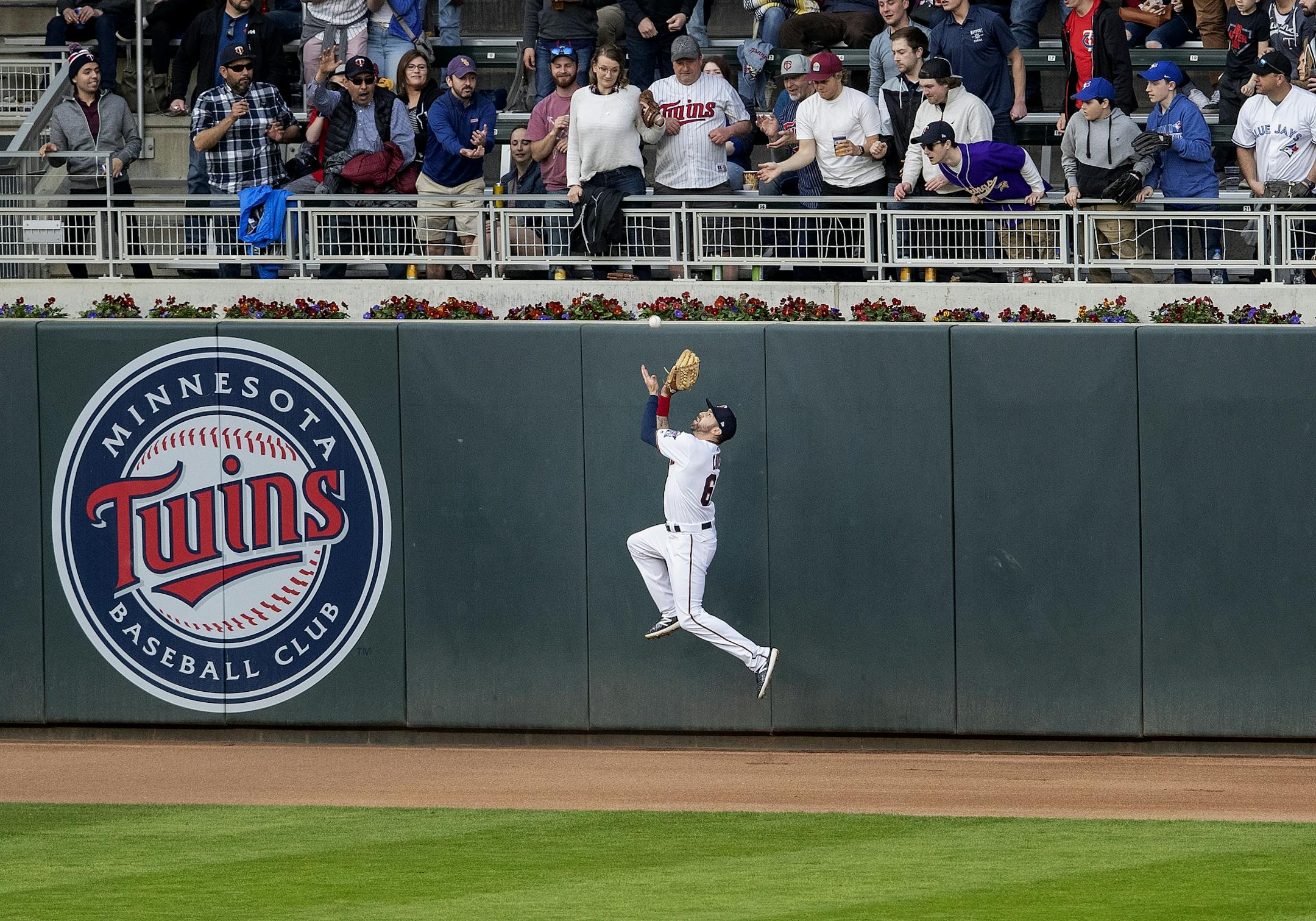 Twins left fielder Jake Cave caught a fly ball by Rowdy Tellez in the second inning.