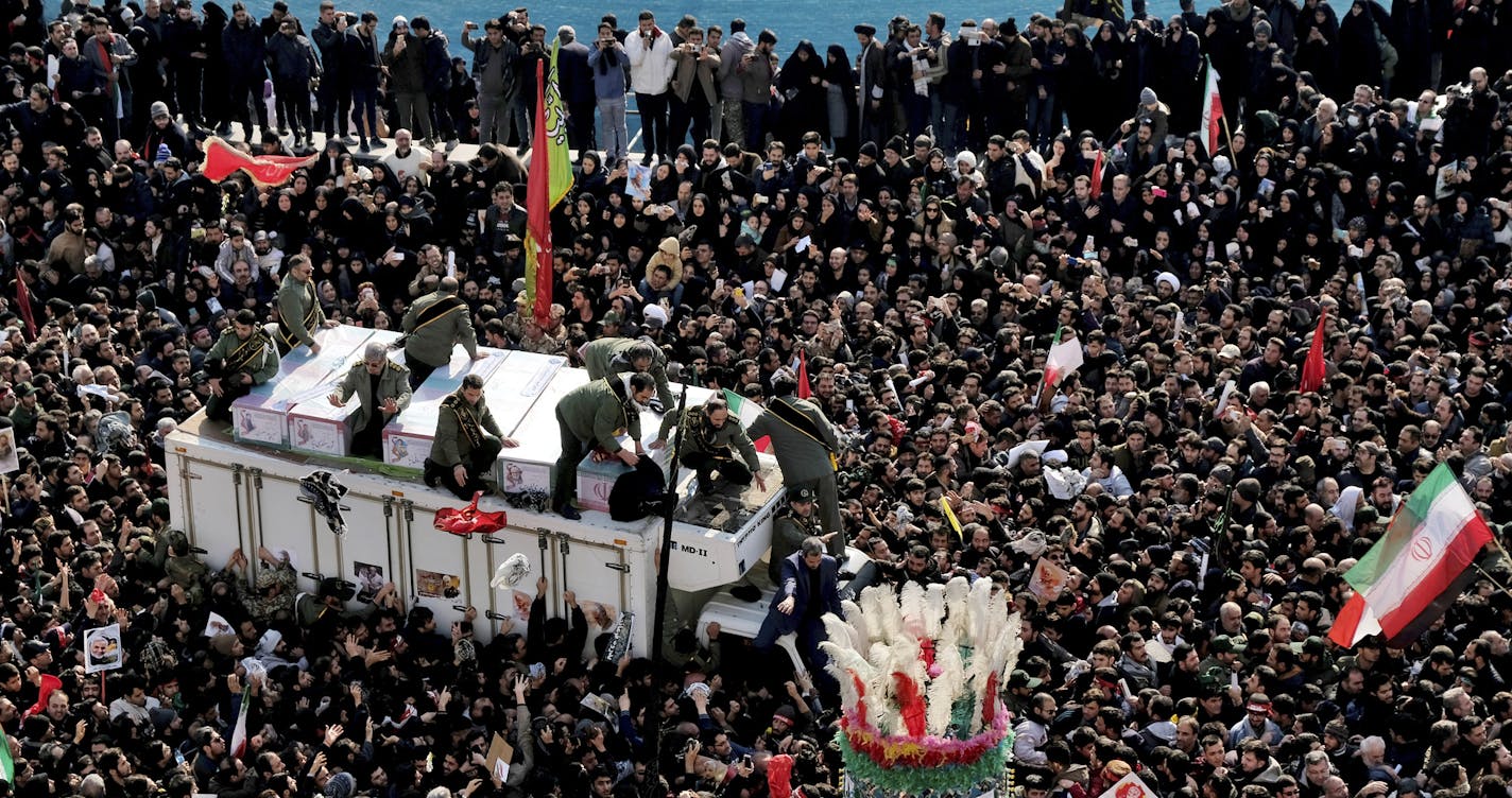 Coffins of Gen. Qassem Soleimani and others who were killed in Iraq by a U.S. drone strike, are carried on a truck surrounded by mourners during a funeral procession at the Enqelab-e-Eslami (Islamic Revolution) square in Tehran, Iran, Monday, Jan. 6, 2020. The processions mark the first time Iran honored a single man with a multi-city ceremony. Not even Ayatollah Ruhollah Khomeini, who founded the Islamic Republic, received such a processional with his death in 1989. Soleimani on Monday will lie